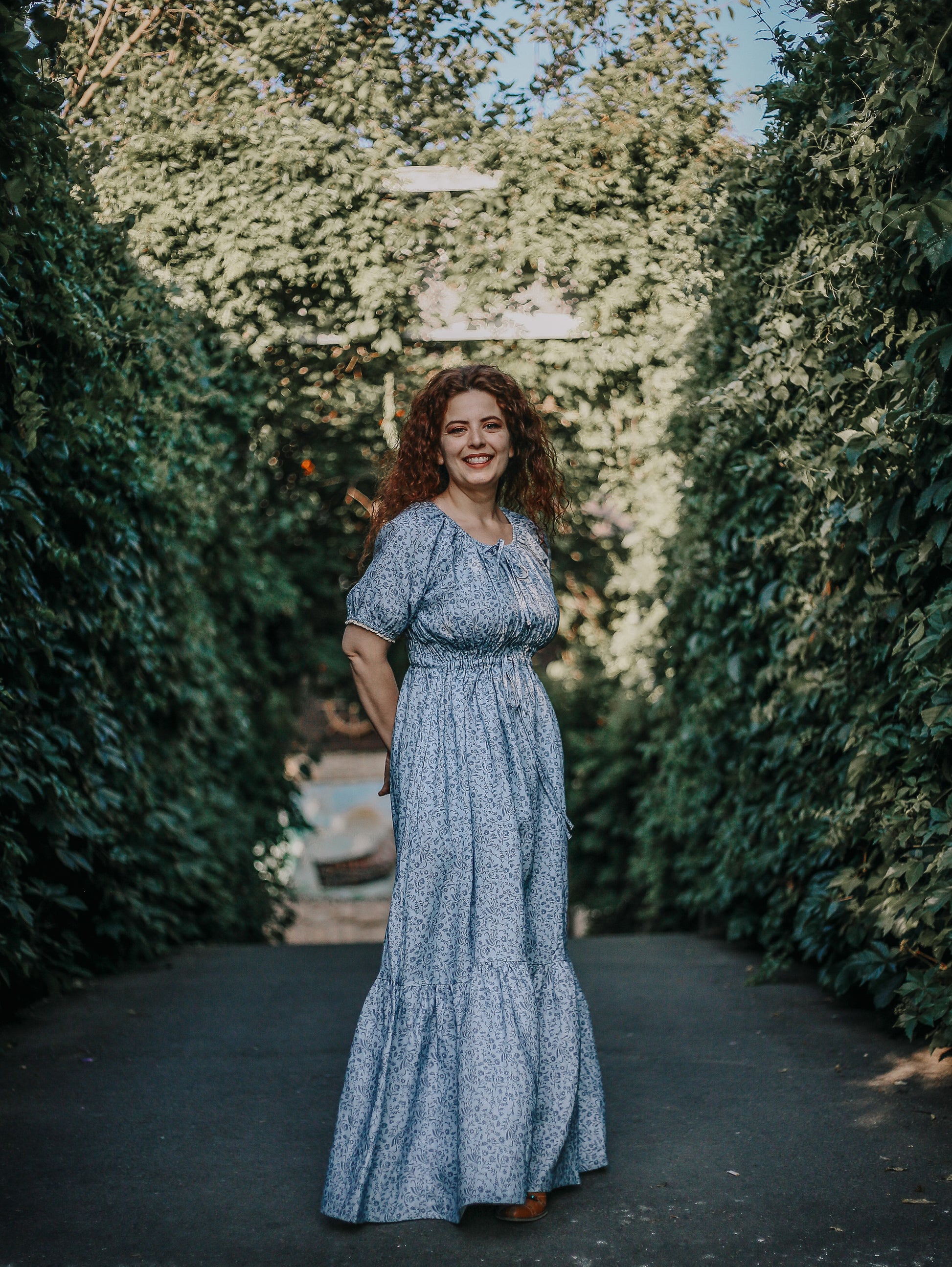 woman in a modest blue nursing dress