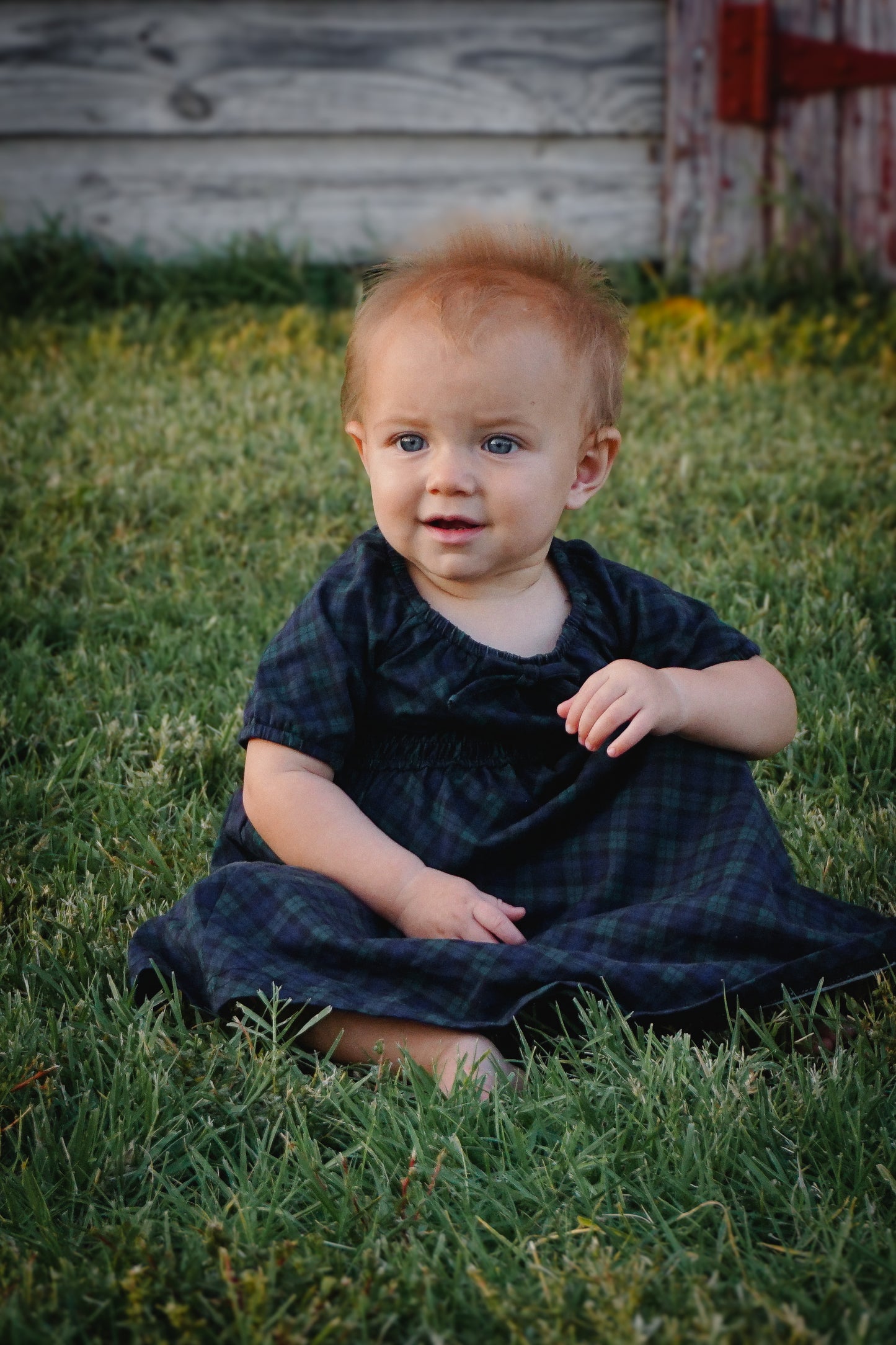 Baby in modest blue dress outdoors