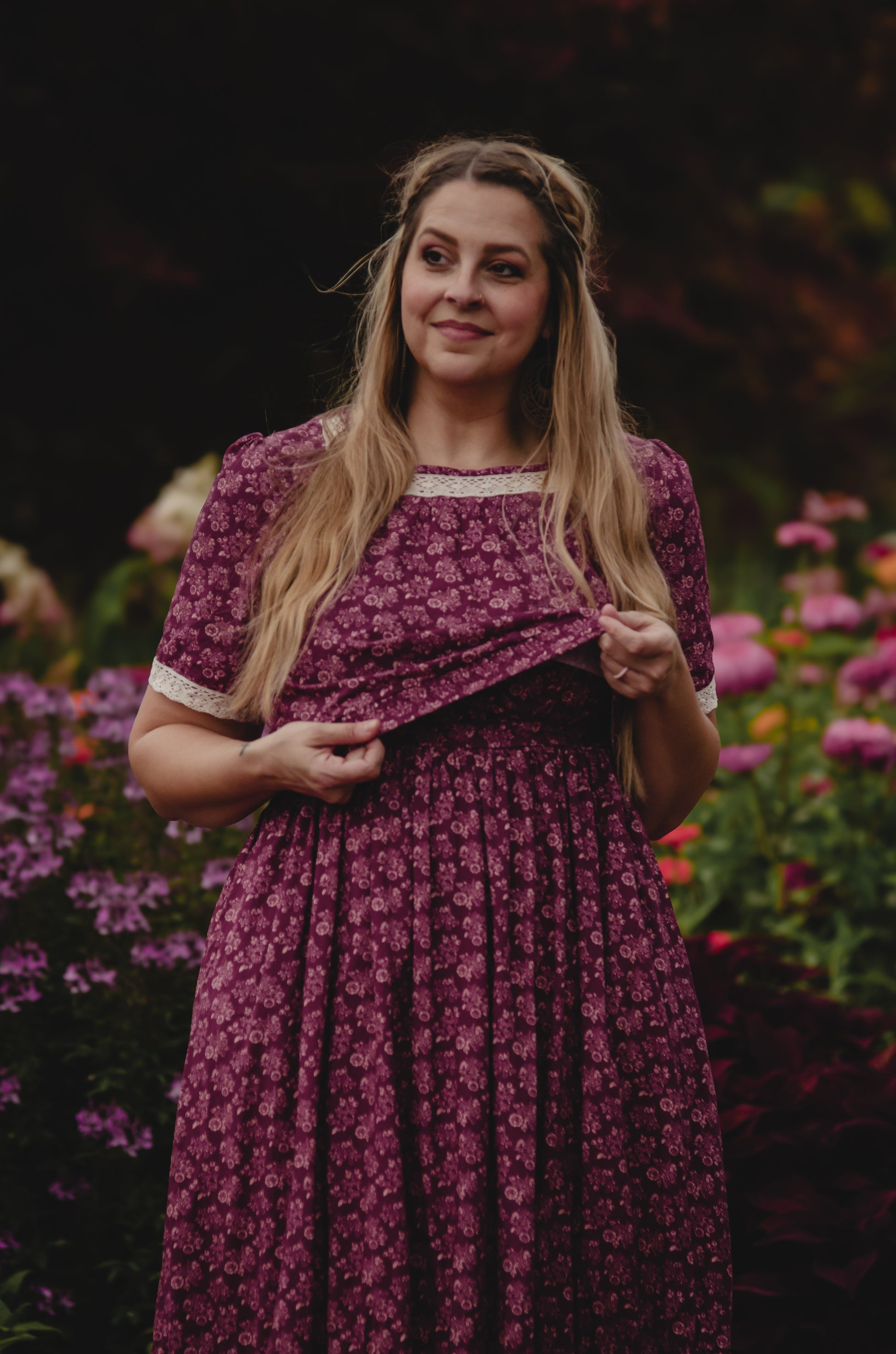 Woman in modest purple floral nursing dress outdoors