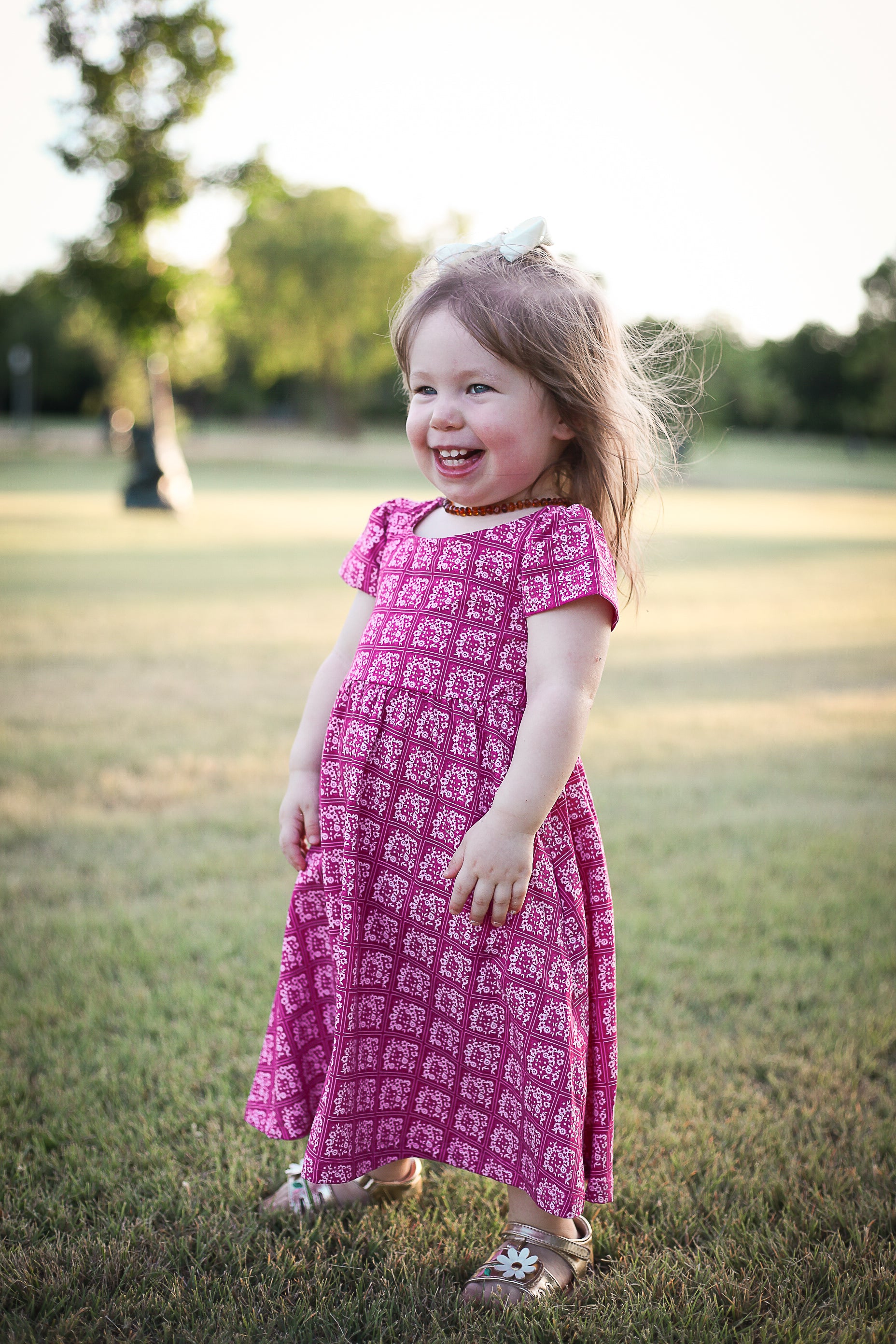 Young girl in a modest pink dress