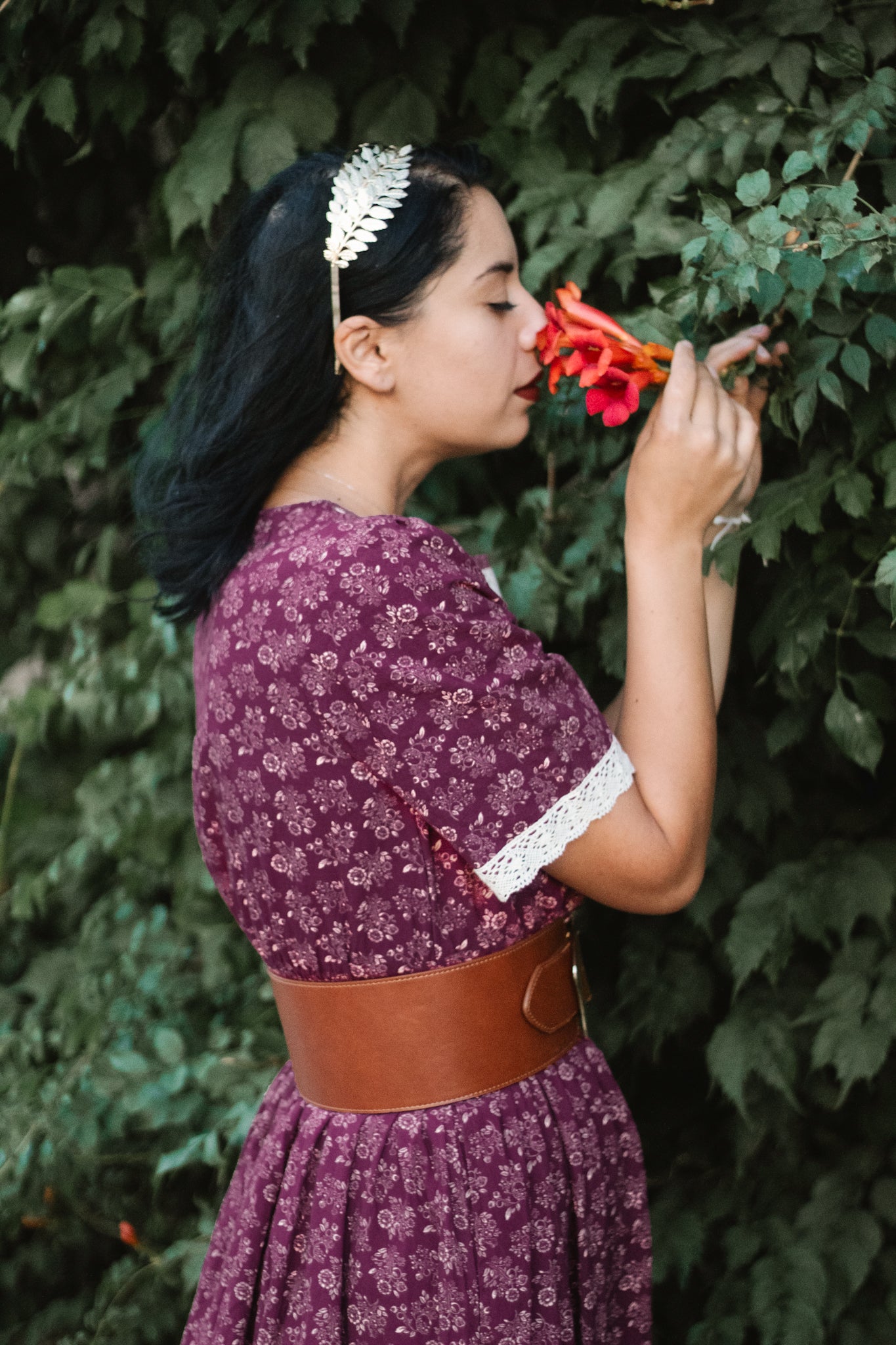 Woman in modest purple floral nursing dress outdoors