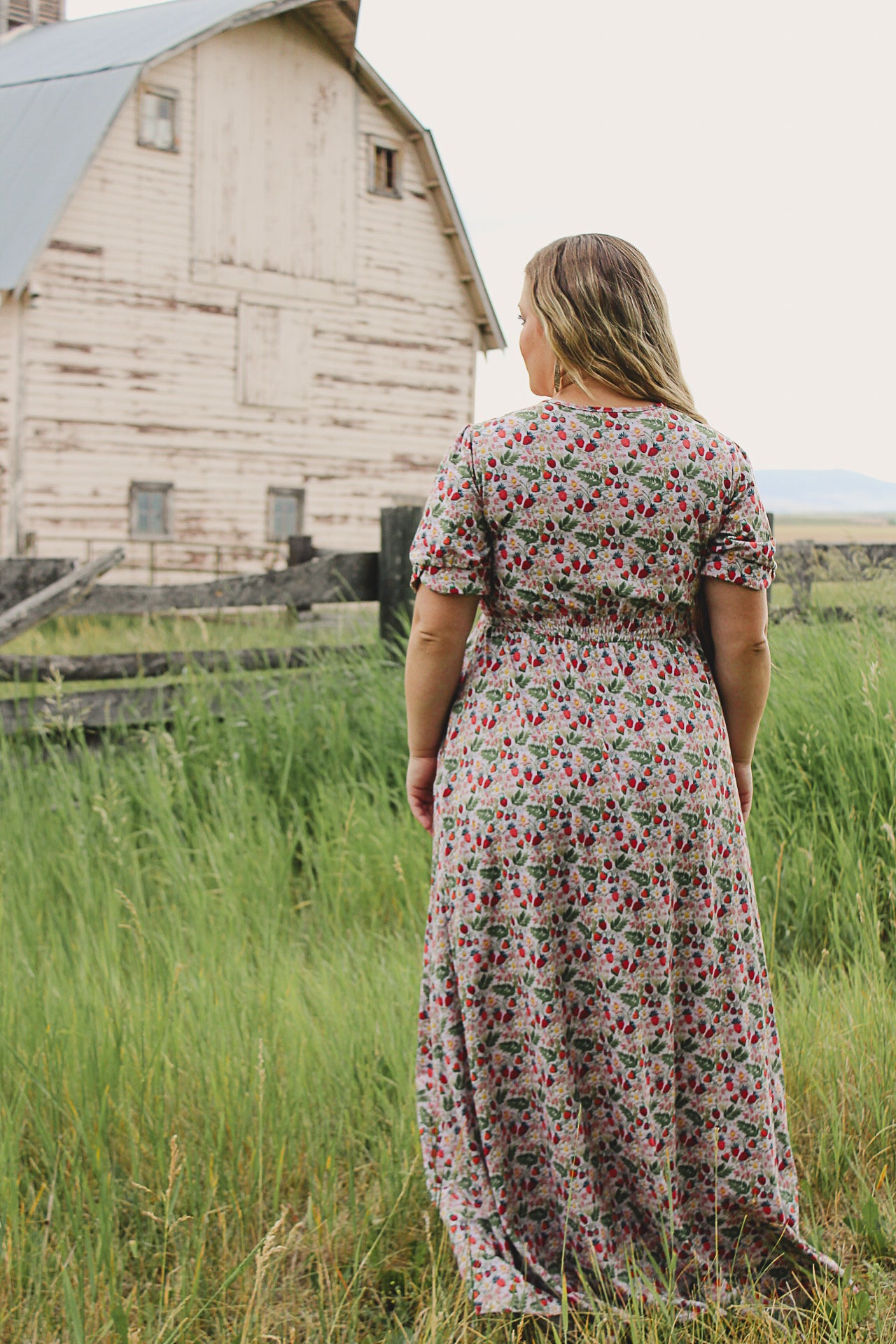 Woman in a floral modest nursing dress.
