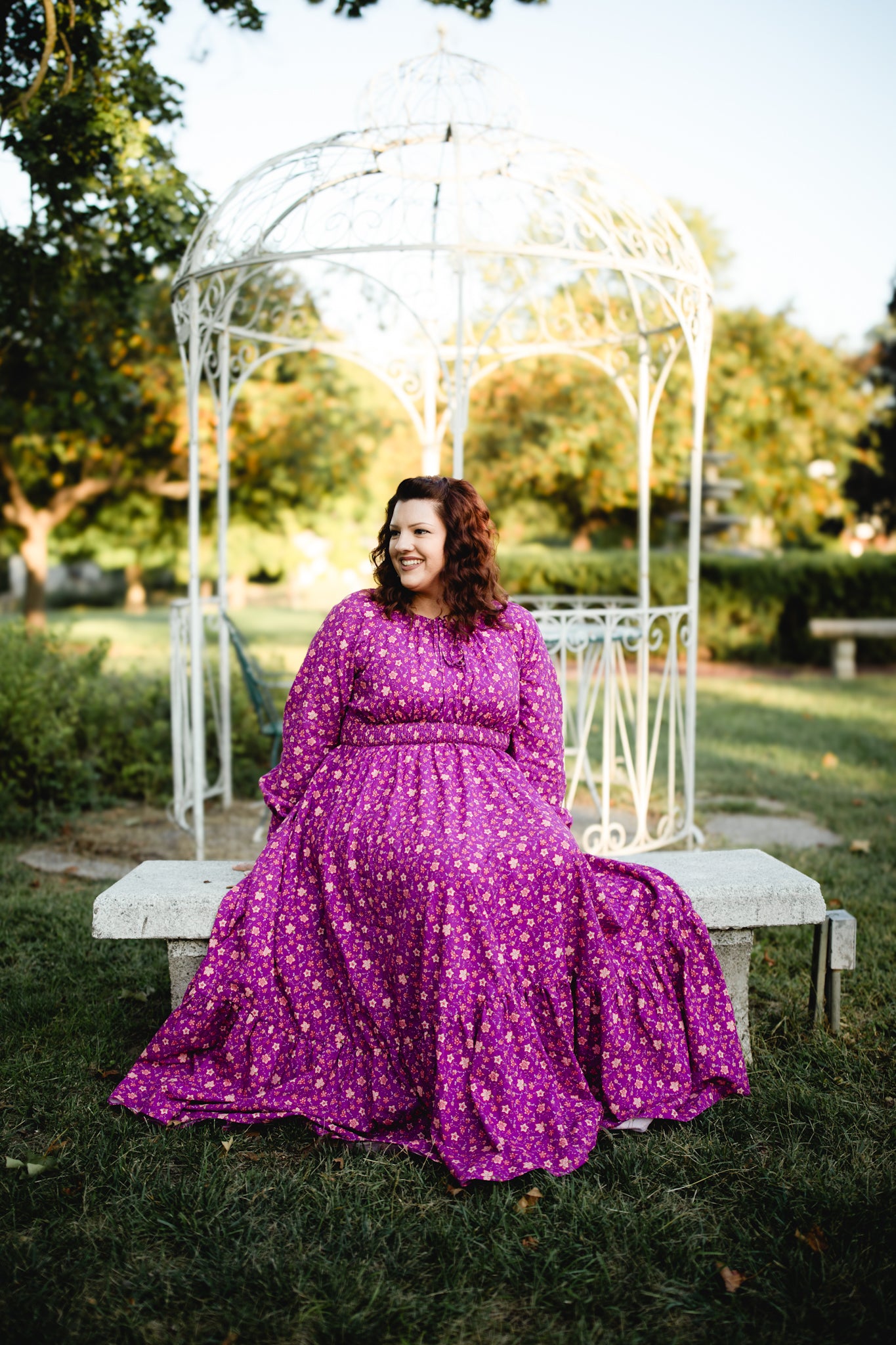 Woman in modest purple nursing dress outdoors