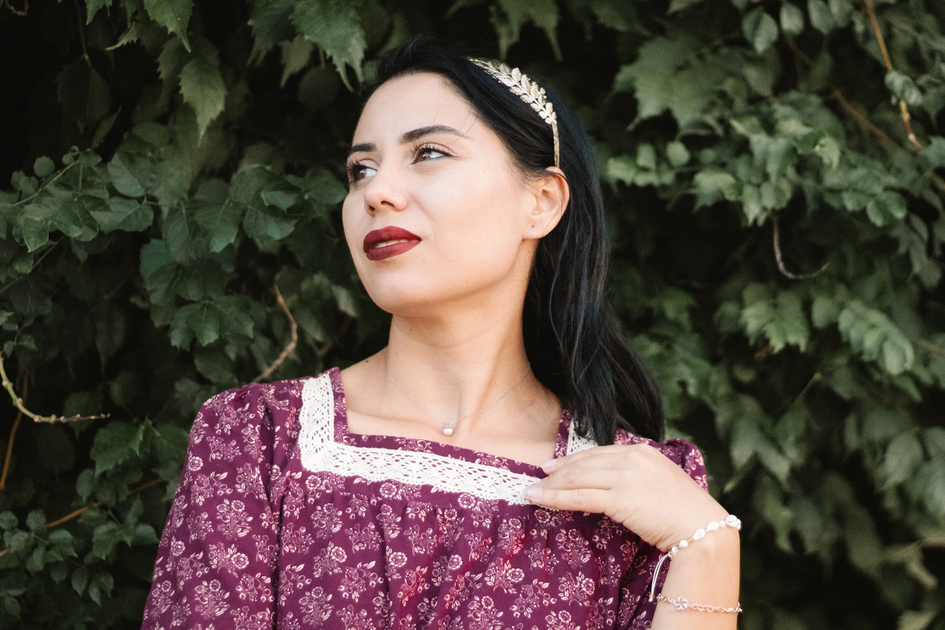 Woman in modest purple nursing dress outdoors