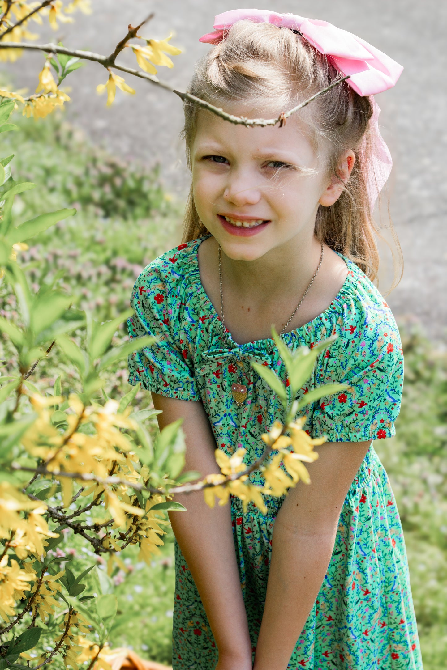 Young girl wearing a modest green dress