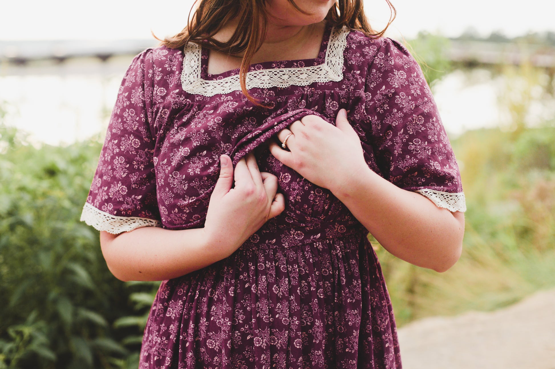 Child in purple floral dress outdoors