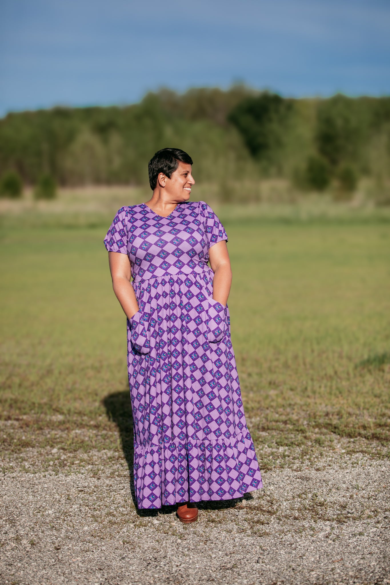woman wearing patterned purple modest nursing dress