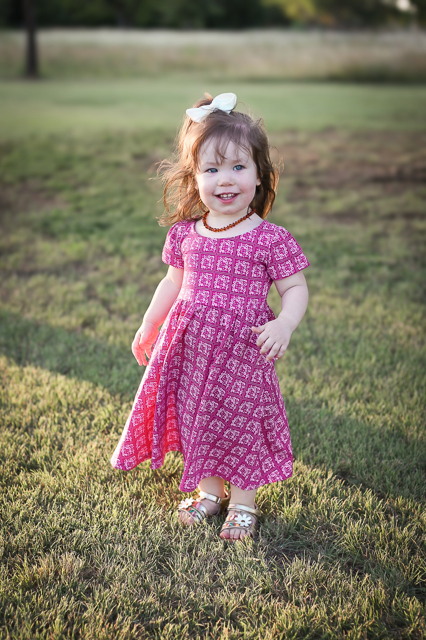 Young girl in a modest pink dress