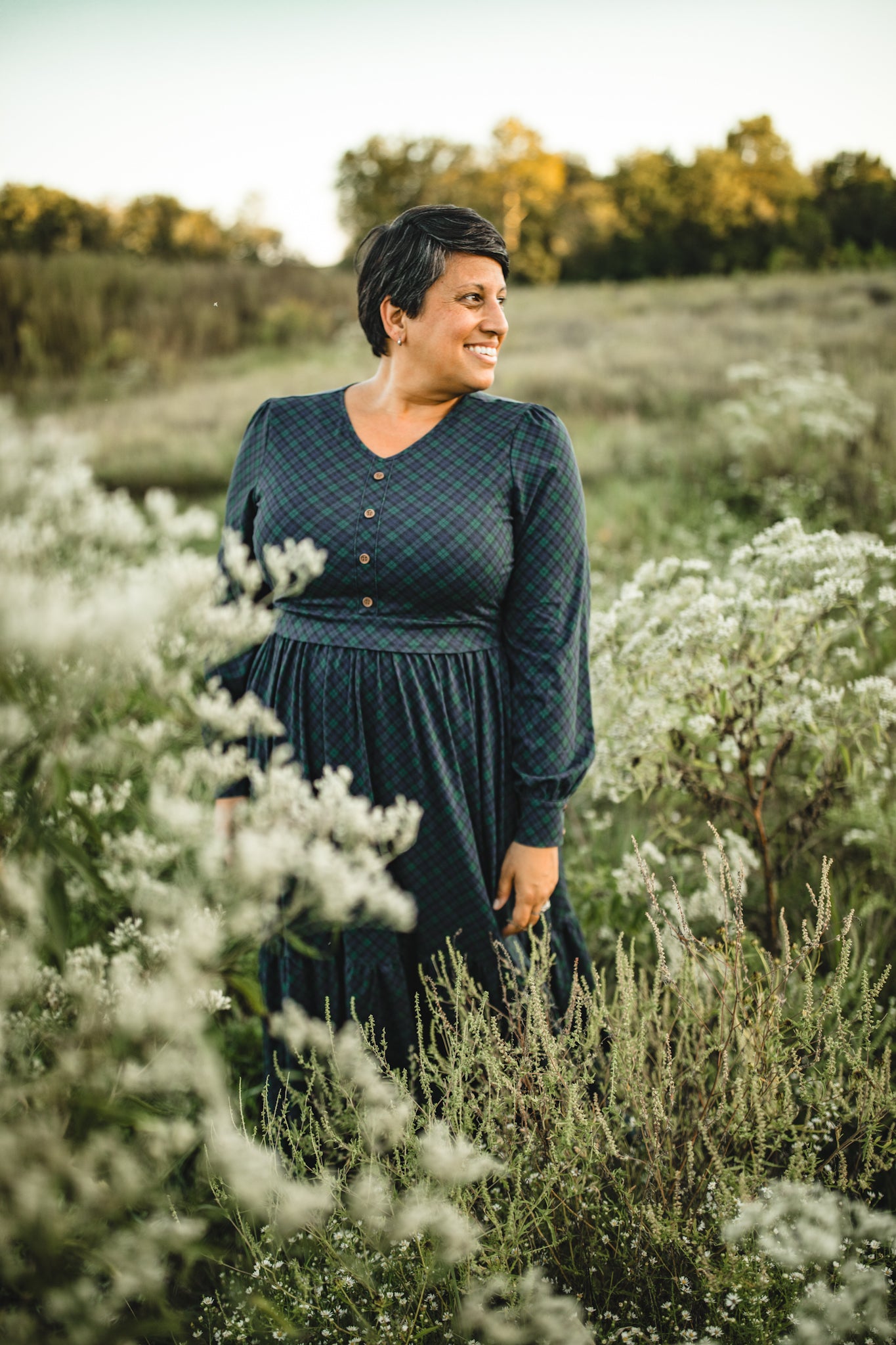 Woman in modest nursing blue dress white flowers