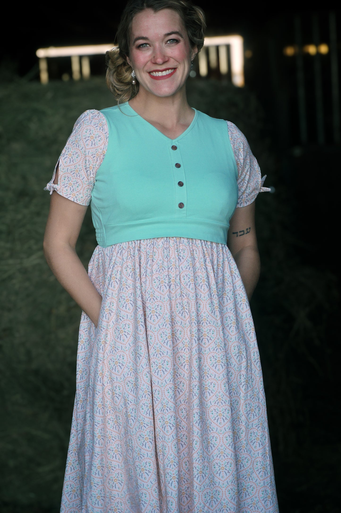 A woman wearing a vintage style modest nursing dress.