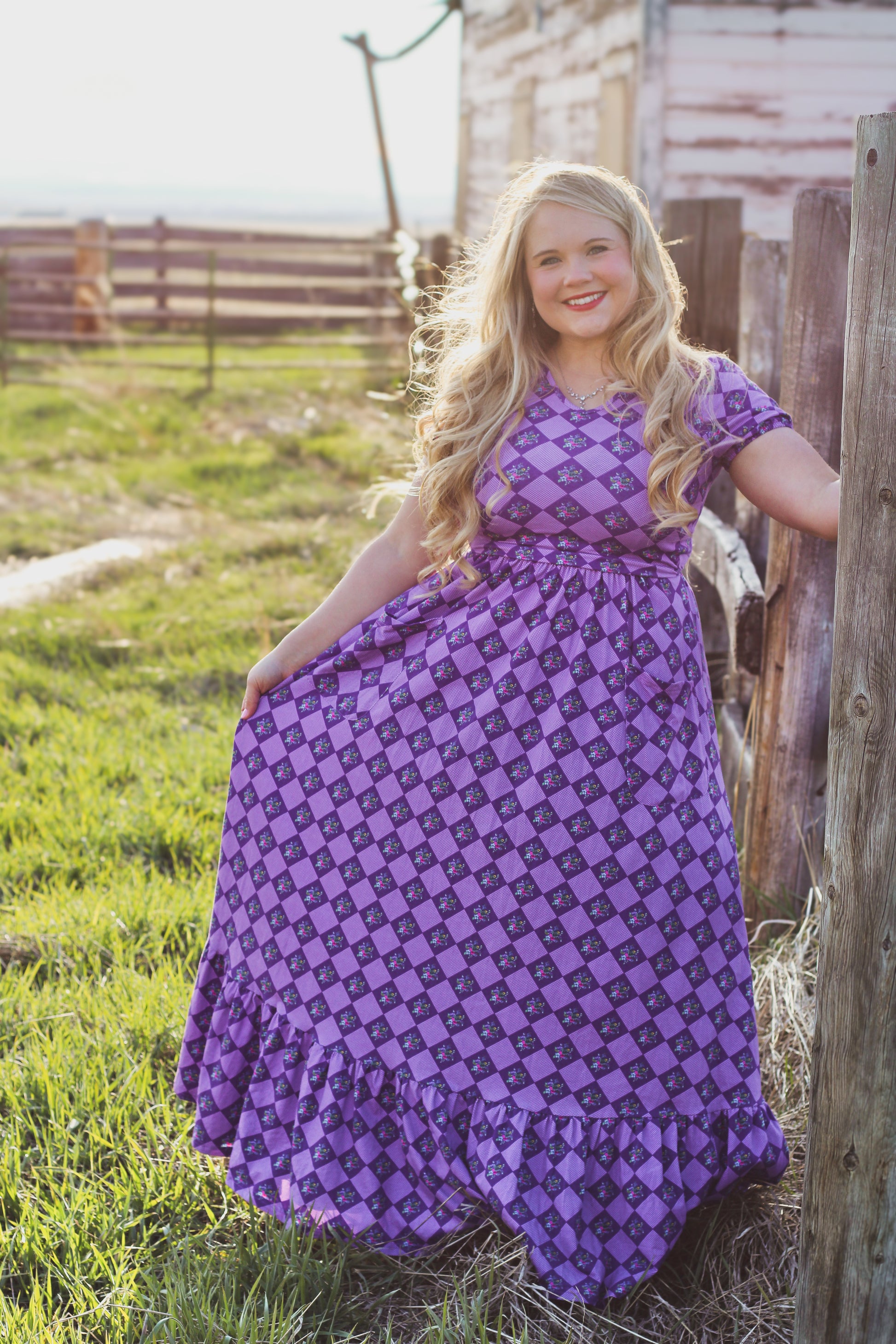 woman wearing a purple modest nursing dress
