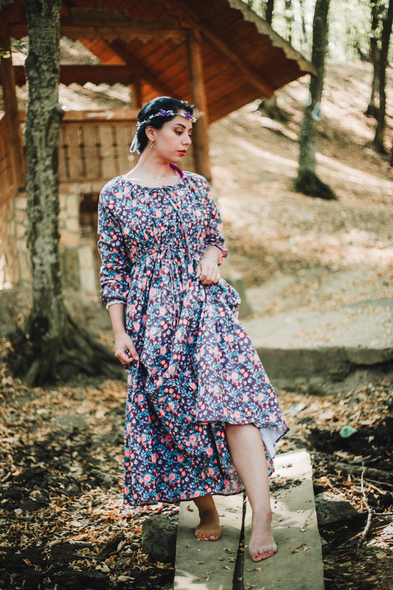 Woman in modest nursing floral dress outdoors