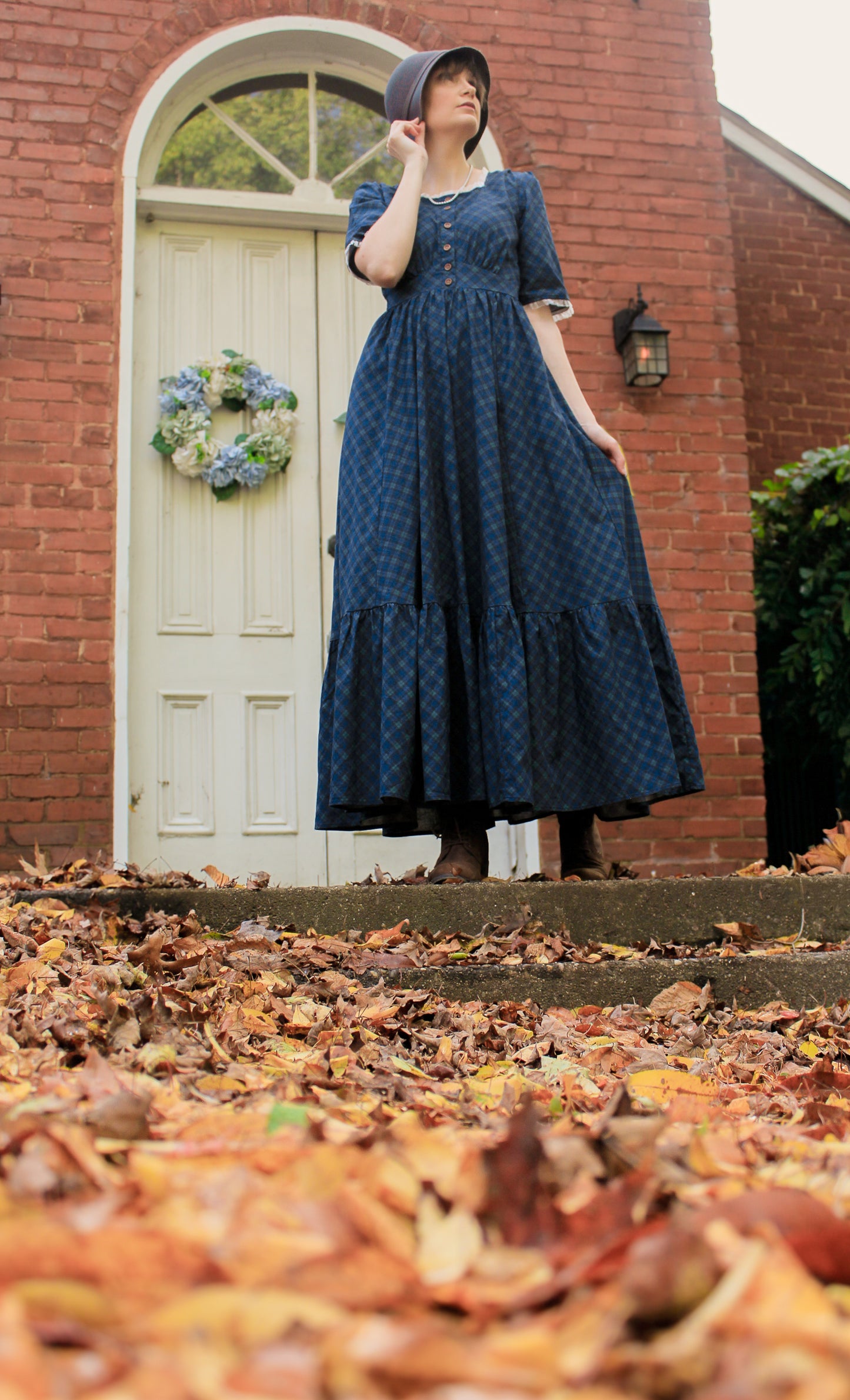 woman wearing a modest nursing blue patterned dress