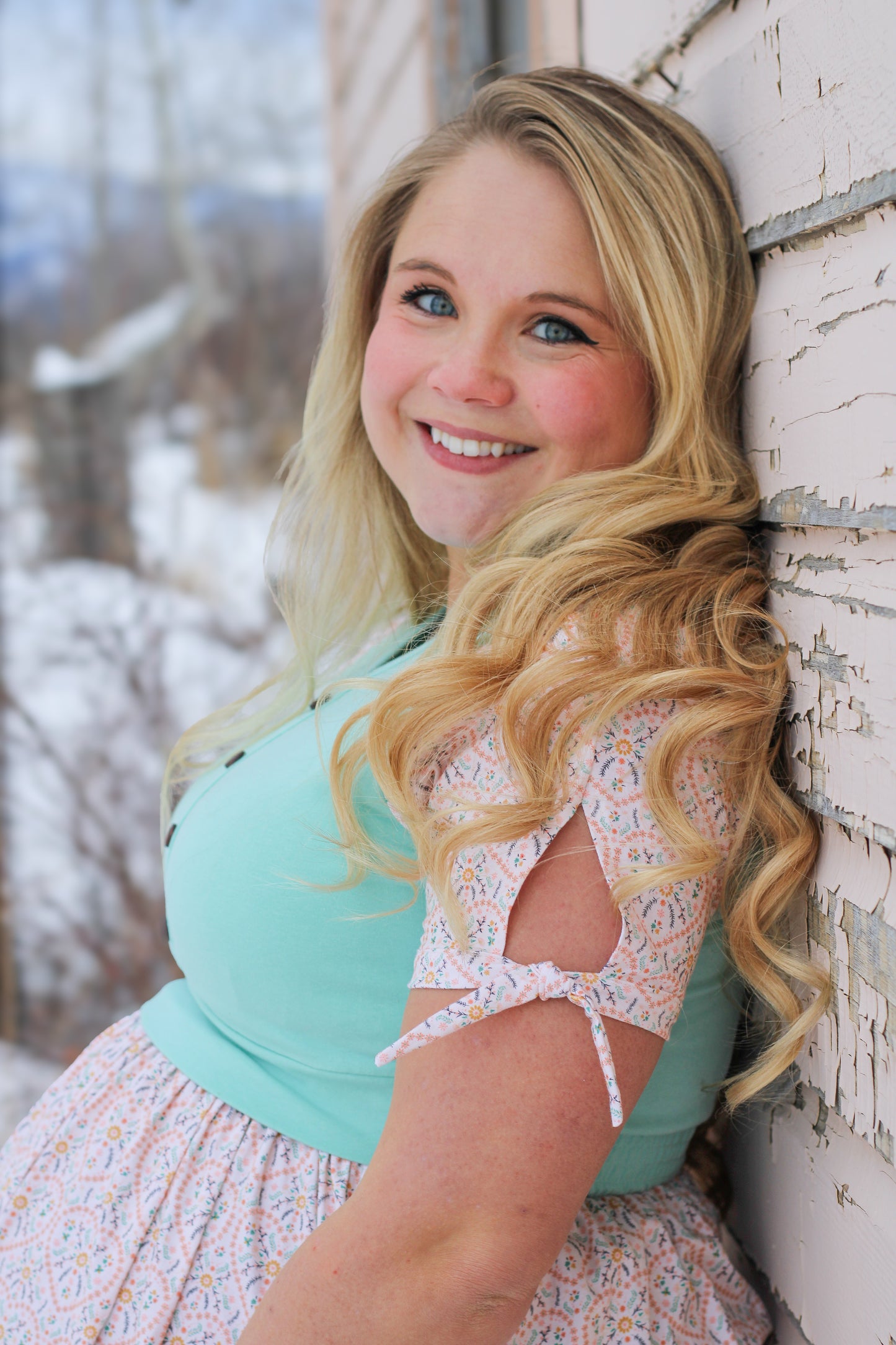 A woman wearing a vintage style modest nursing dress.