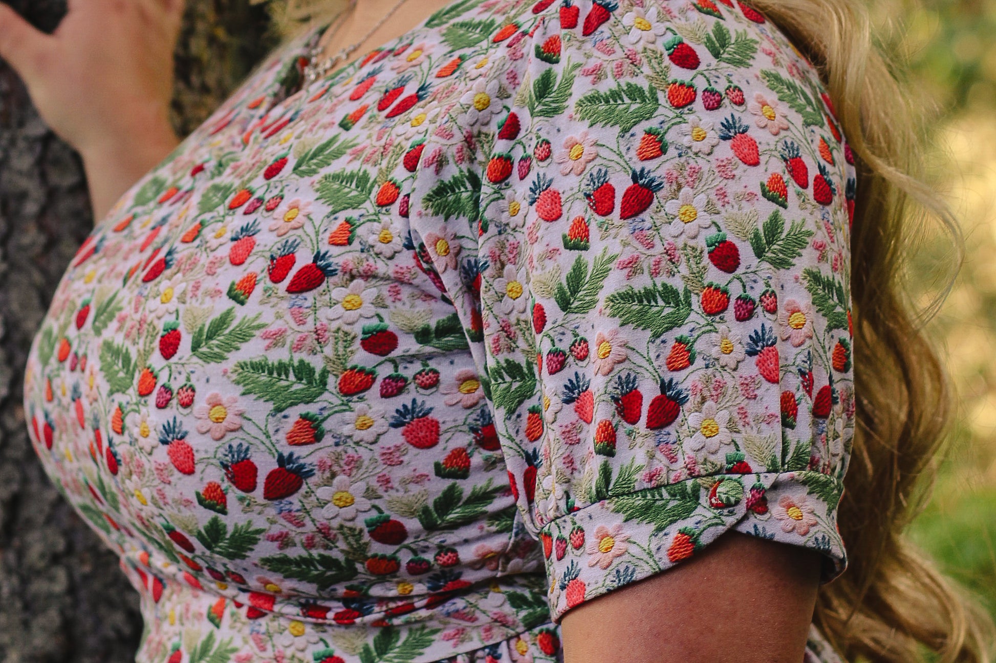 Woman in a floral modest nursing dress