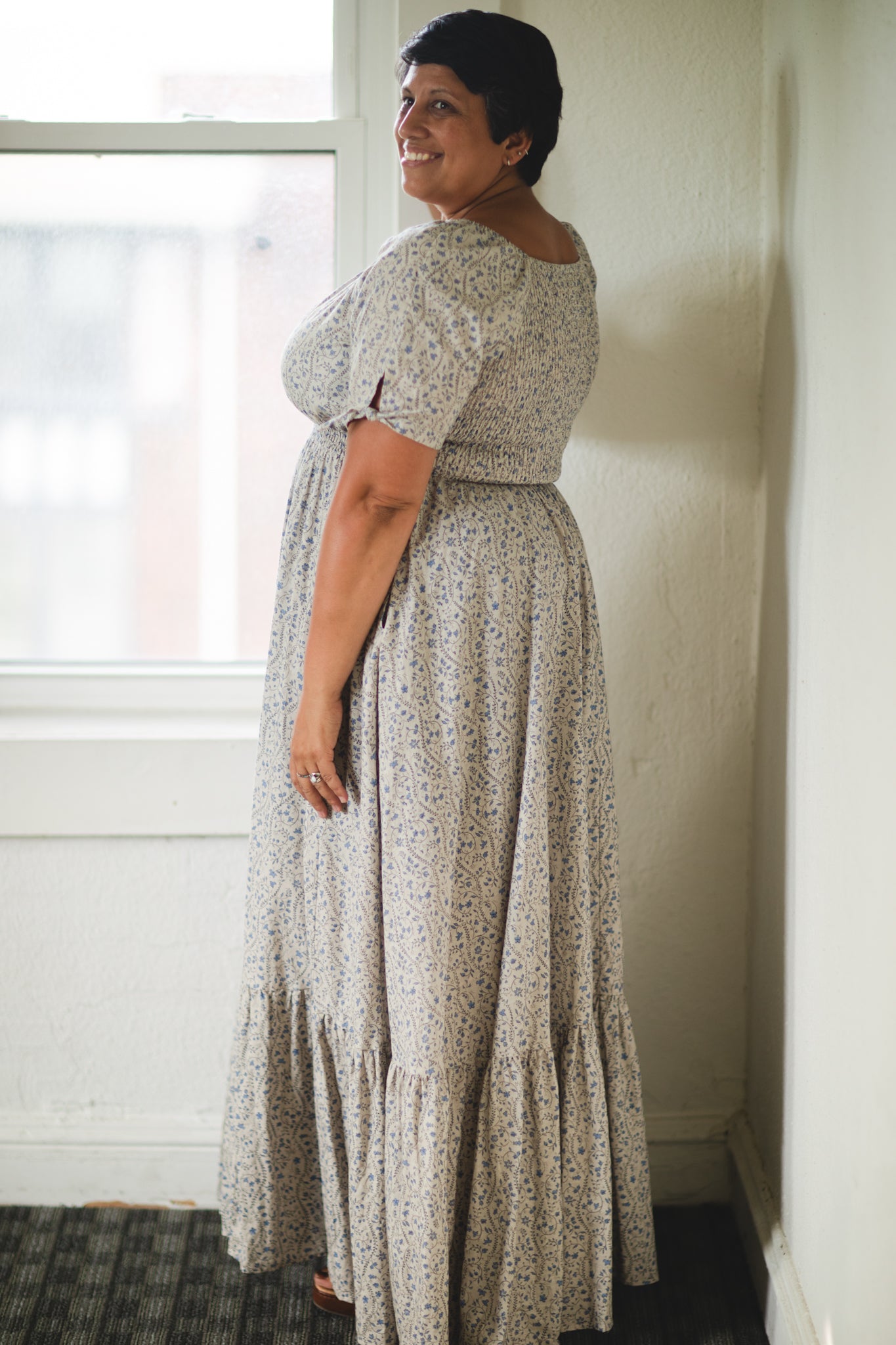 woman in patterned modest nursing dress