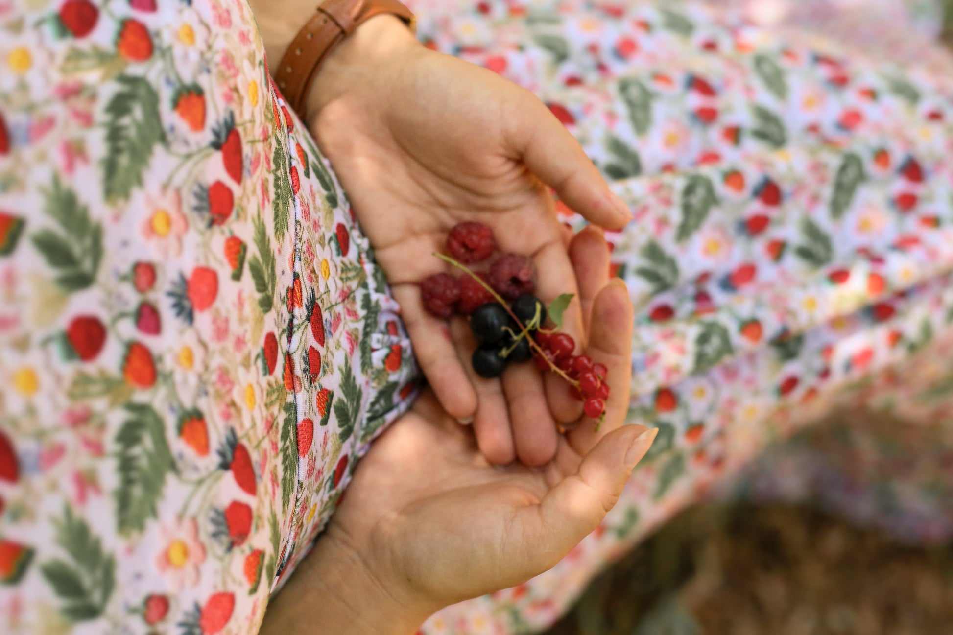 Woman in a floral modest nursing dress.