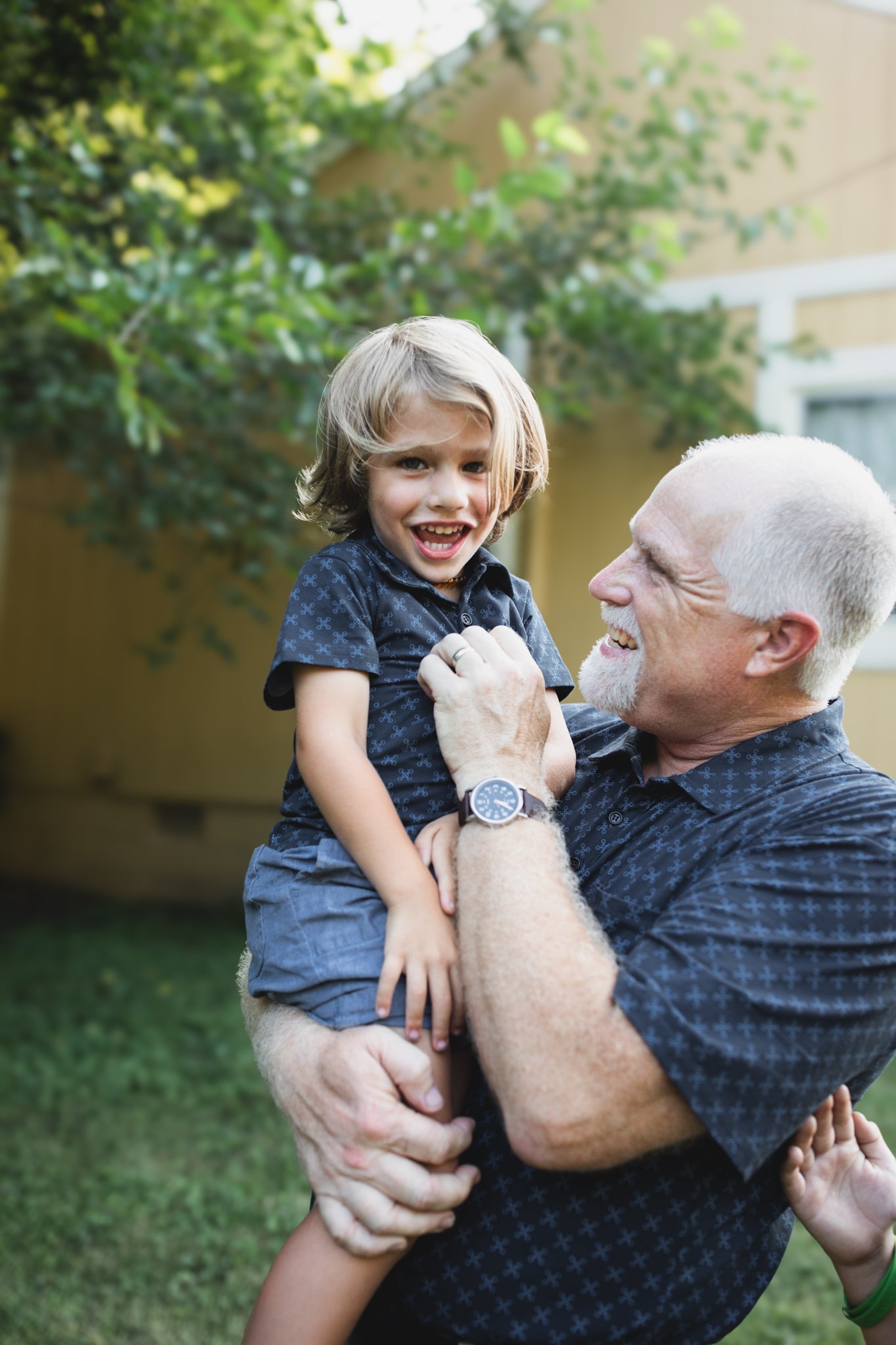 Young boy wearing a dark blue polo shirt