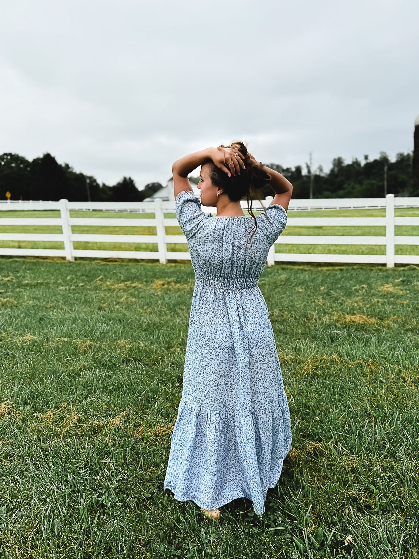 woman in a modest blue nursing dress