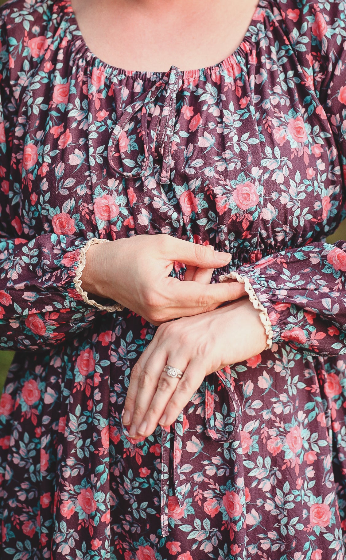 Woman in modest nursing dress hands