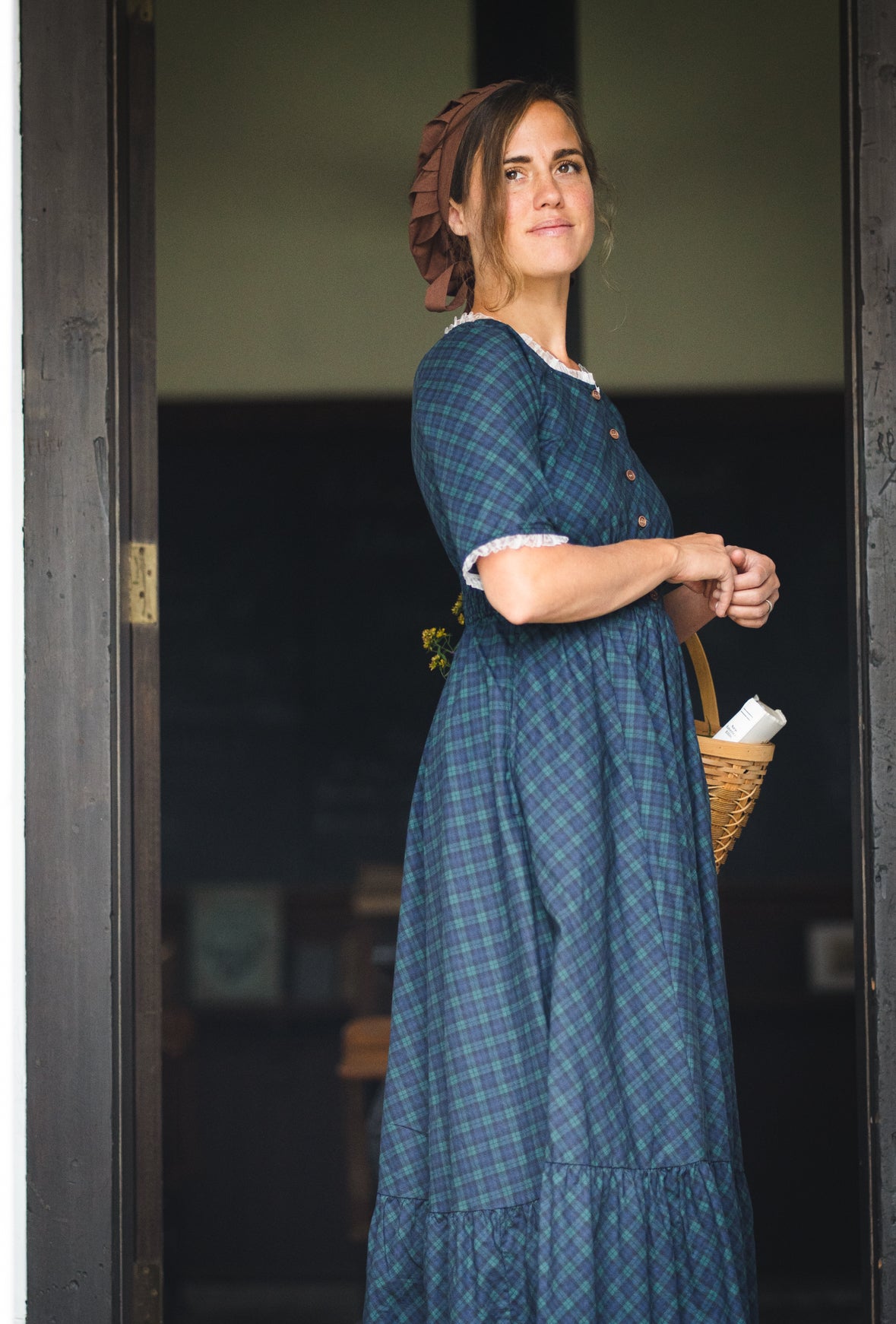 woman wearing a modest nursing blue patterned dress