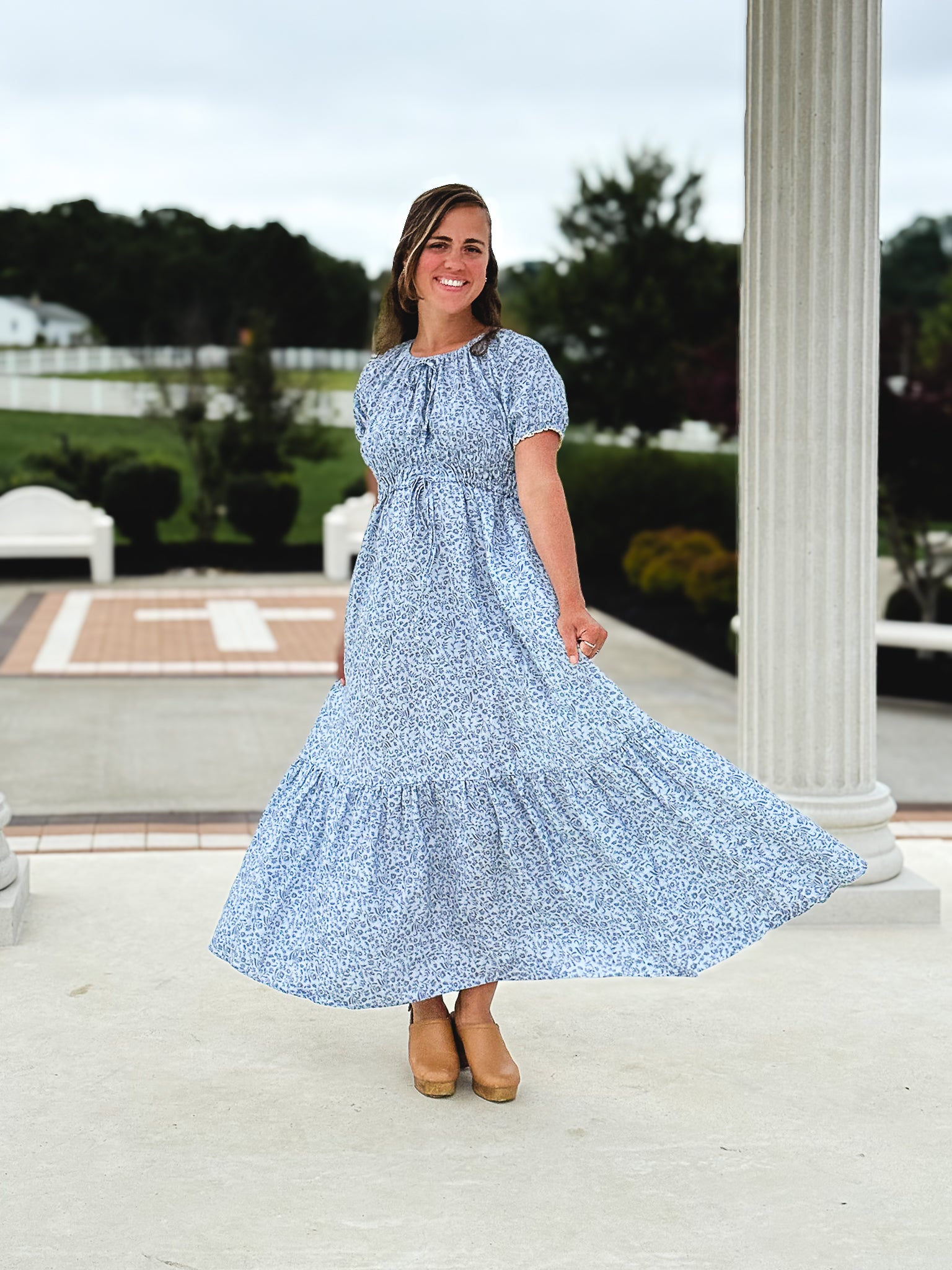 woman in a modest blue nursing dress