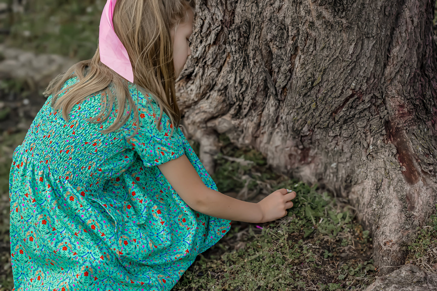 Young girl wearing a modest green dress