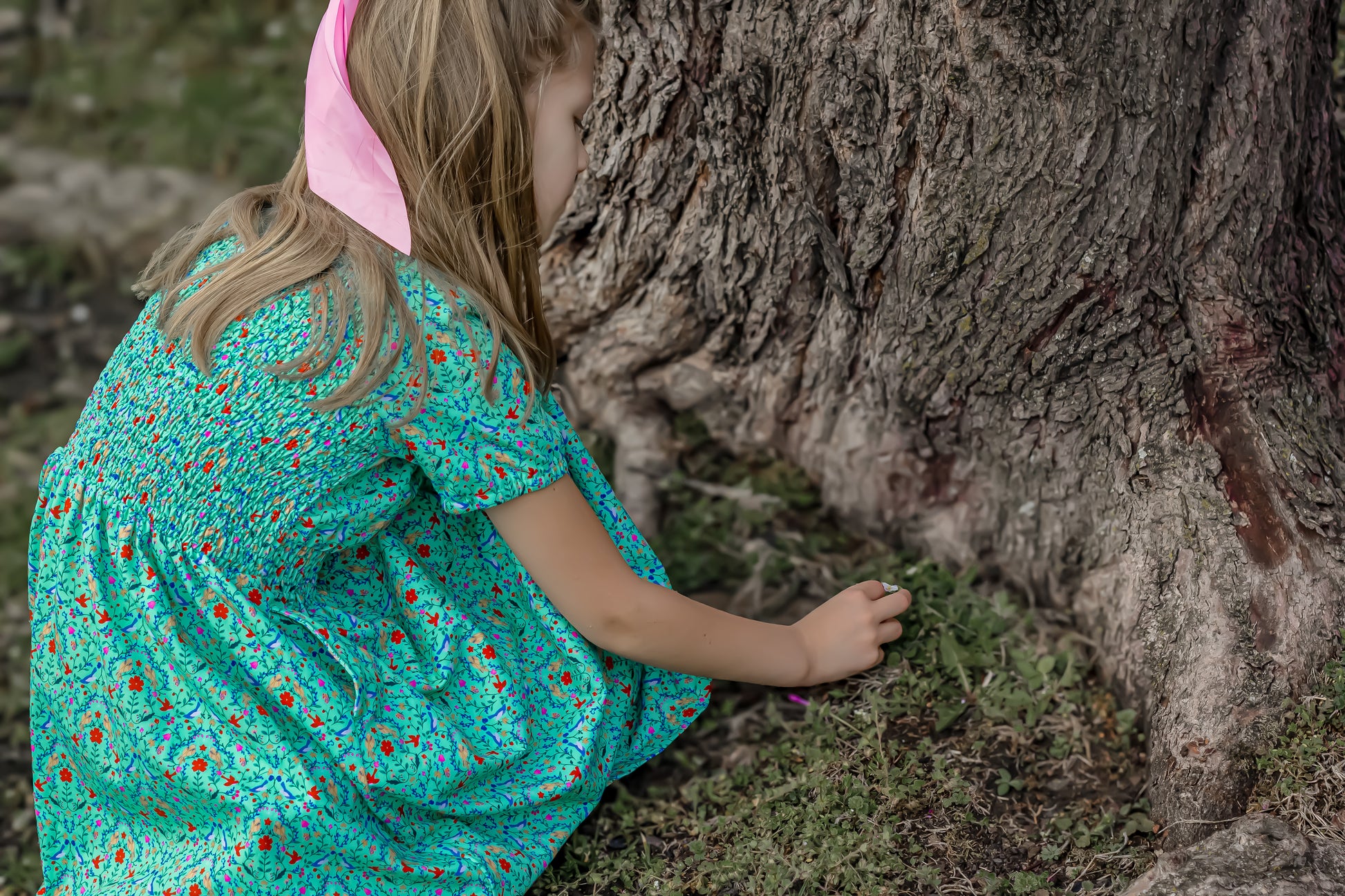 Young girl wearing a modest green dress