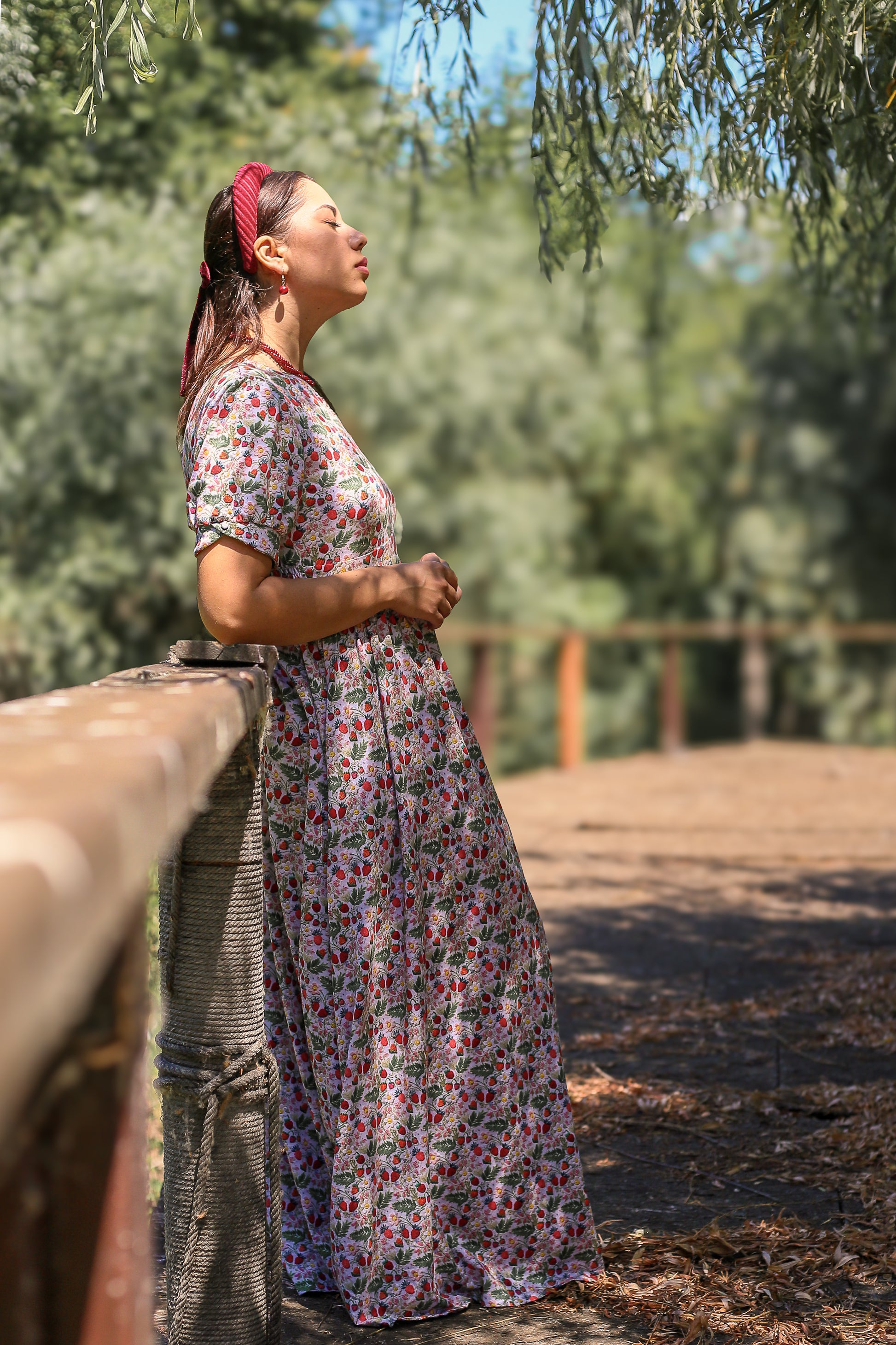 Woman in a floral modest nursing dress
