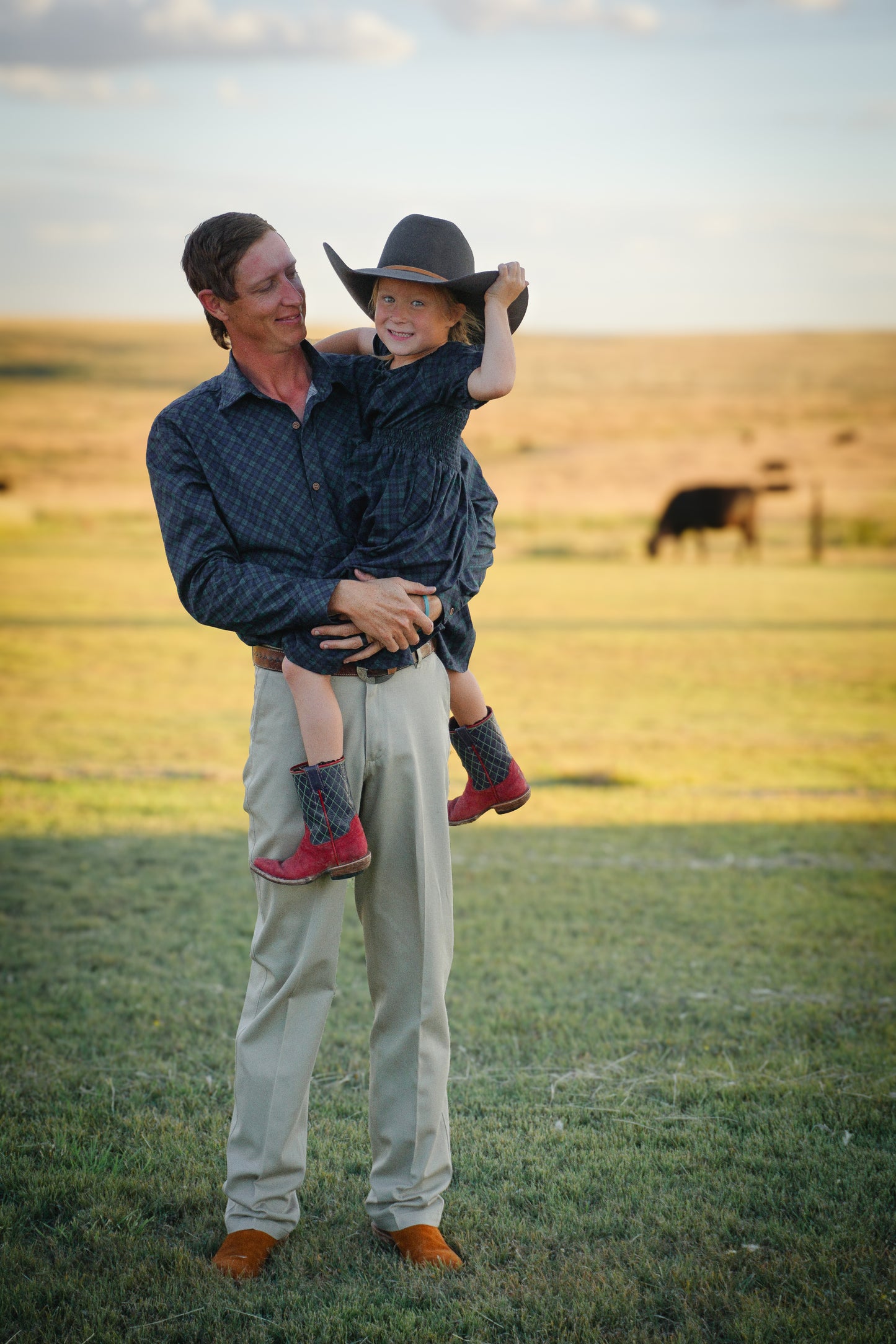 Man holding child in field