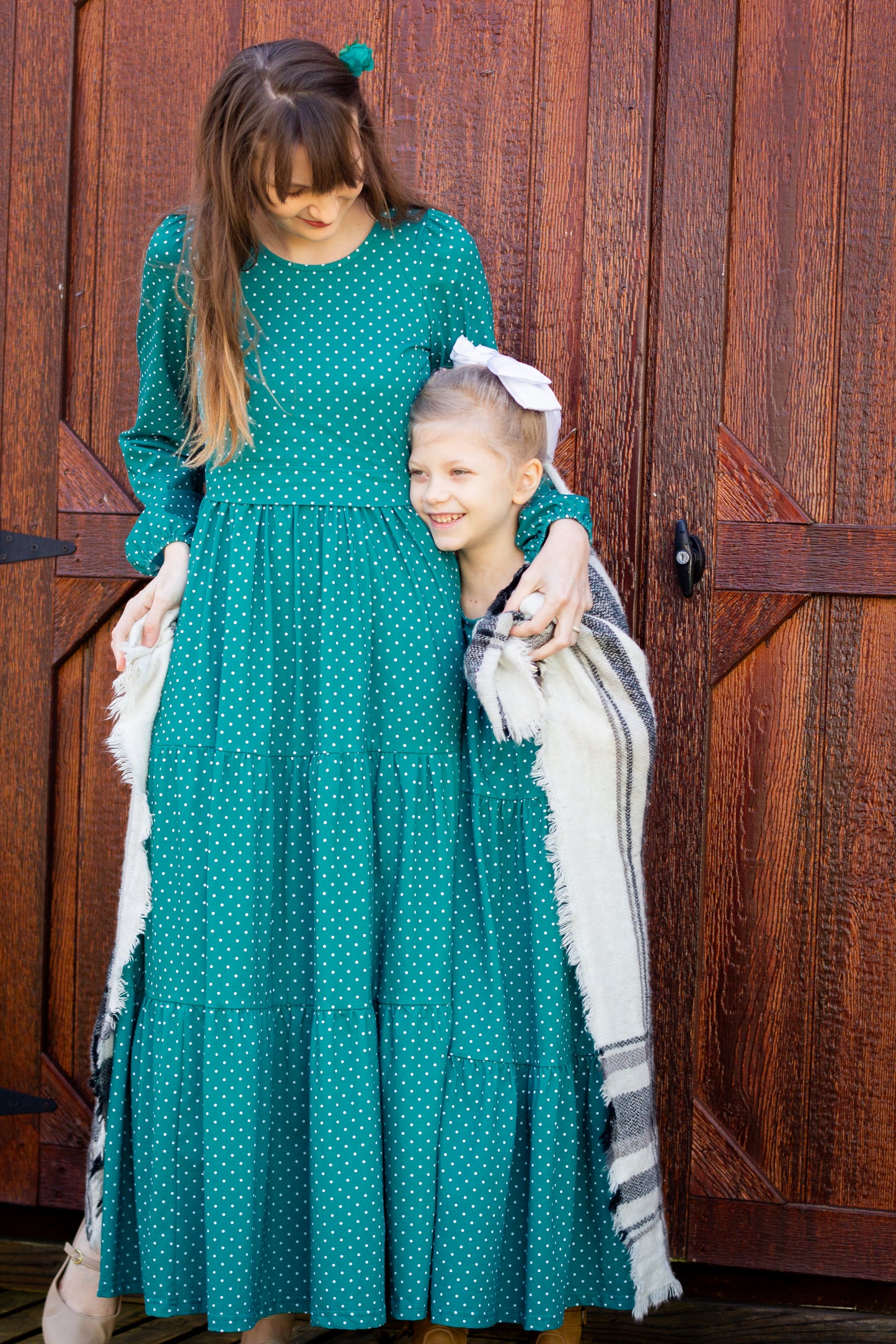 woman wearing modest nursing dress with her daughter wearing a matching dress