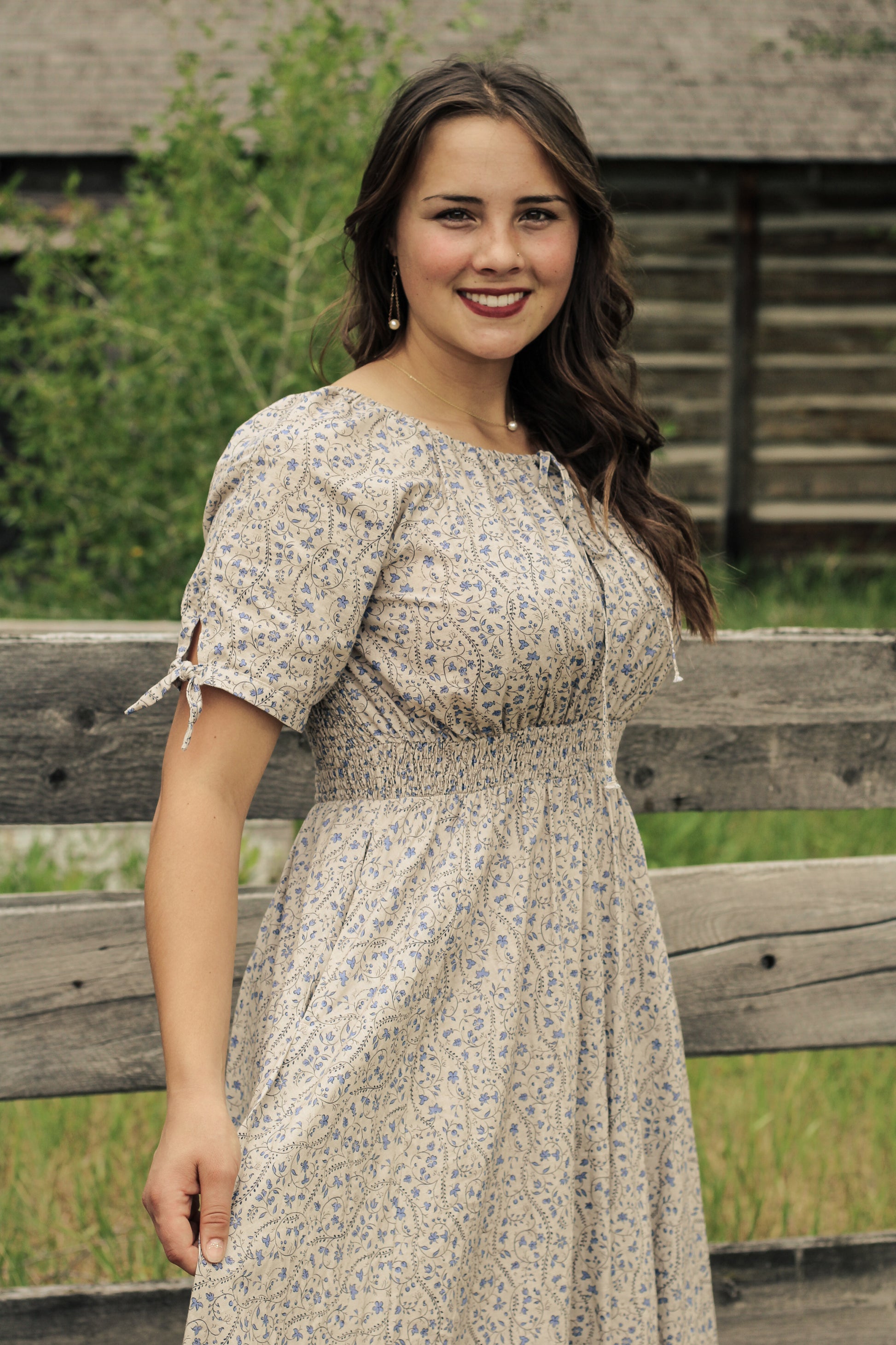 woman in patterned modest nursing dress
