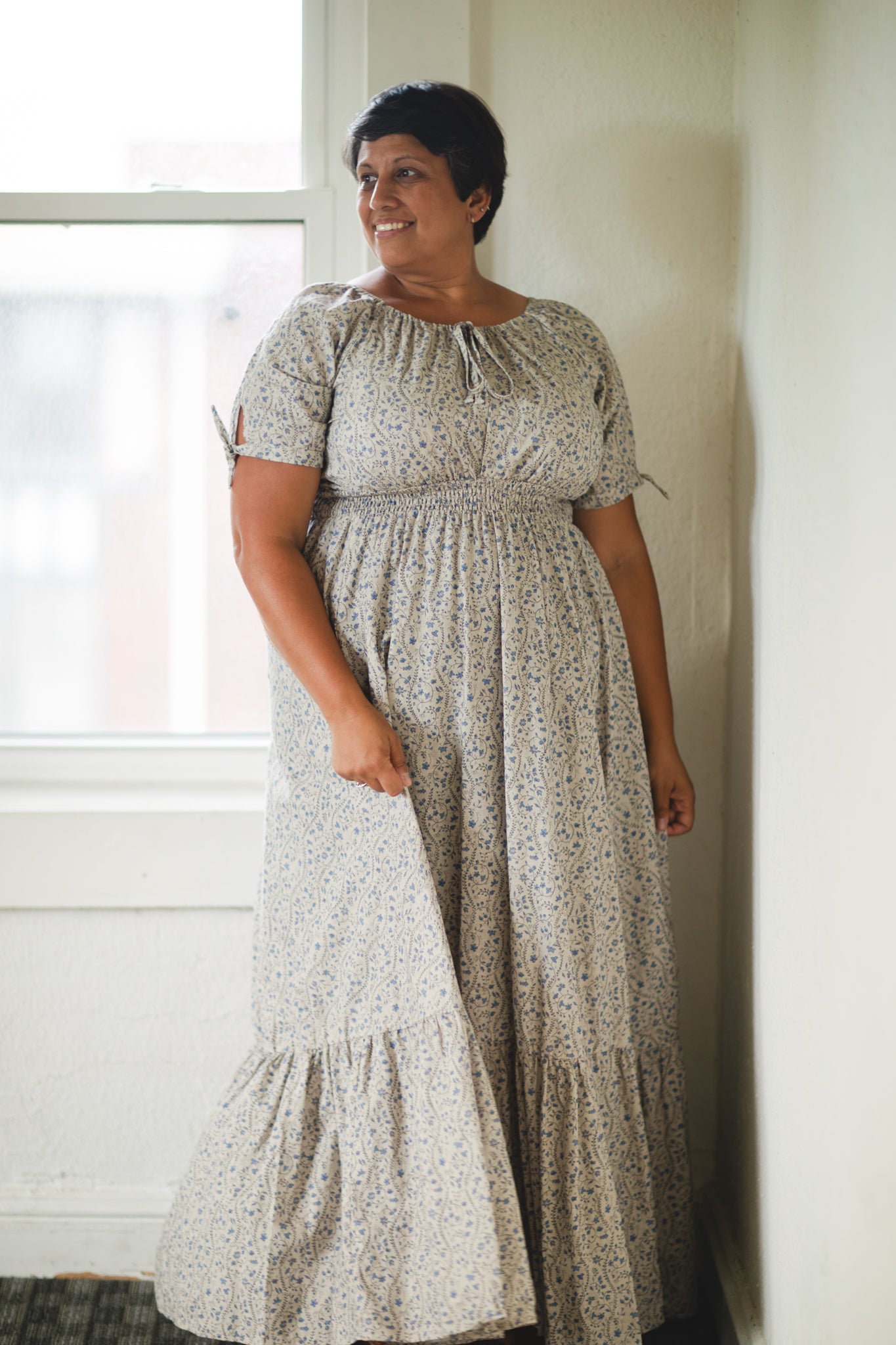 woman in patterned modest nursing dress