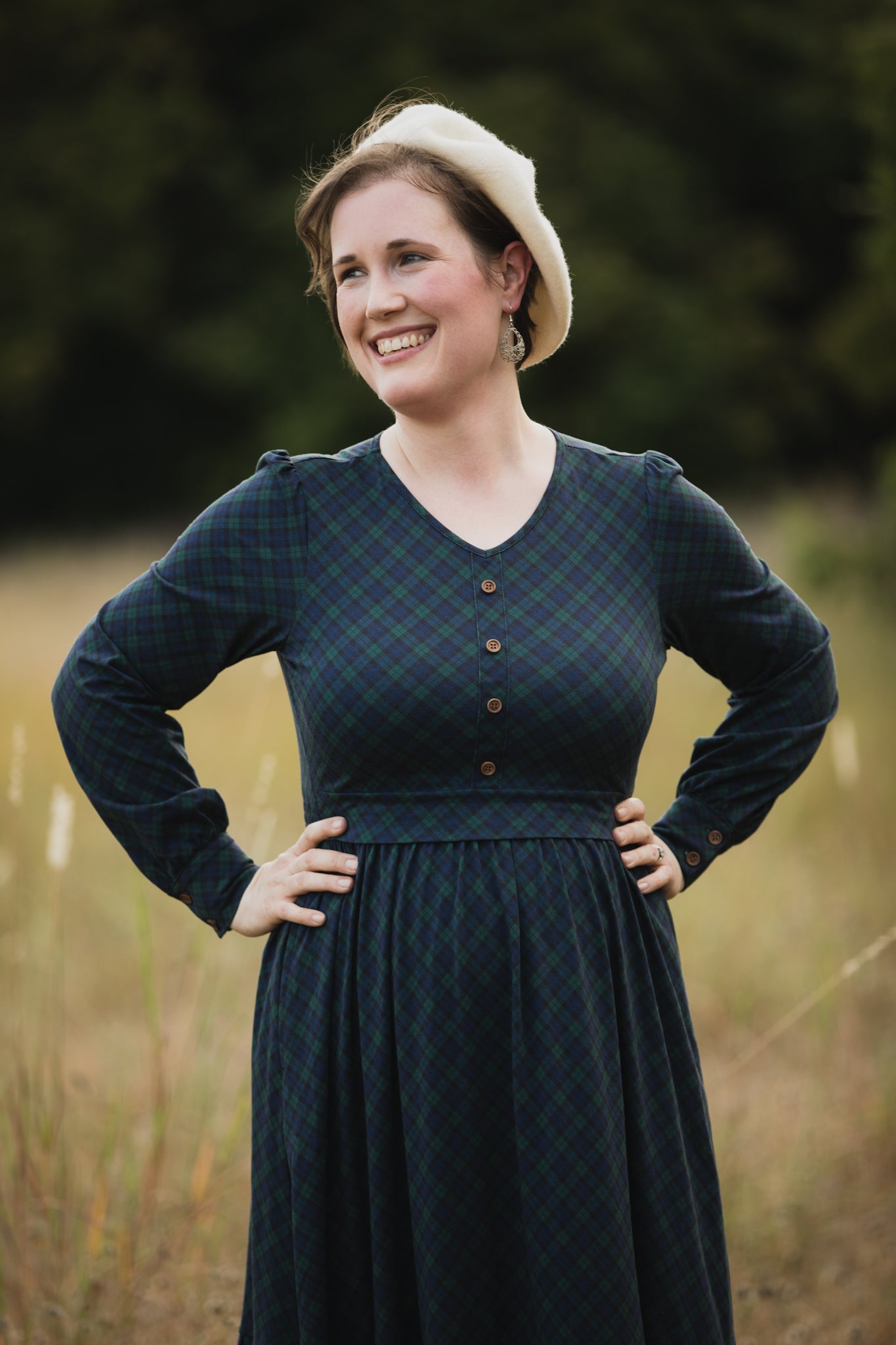 Woman in modest nursing dark green dress outdoors
