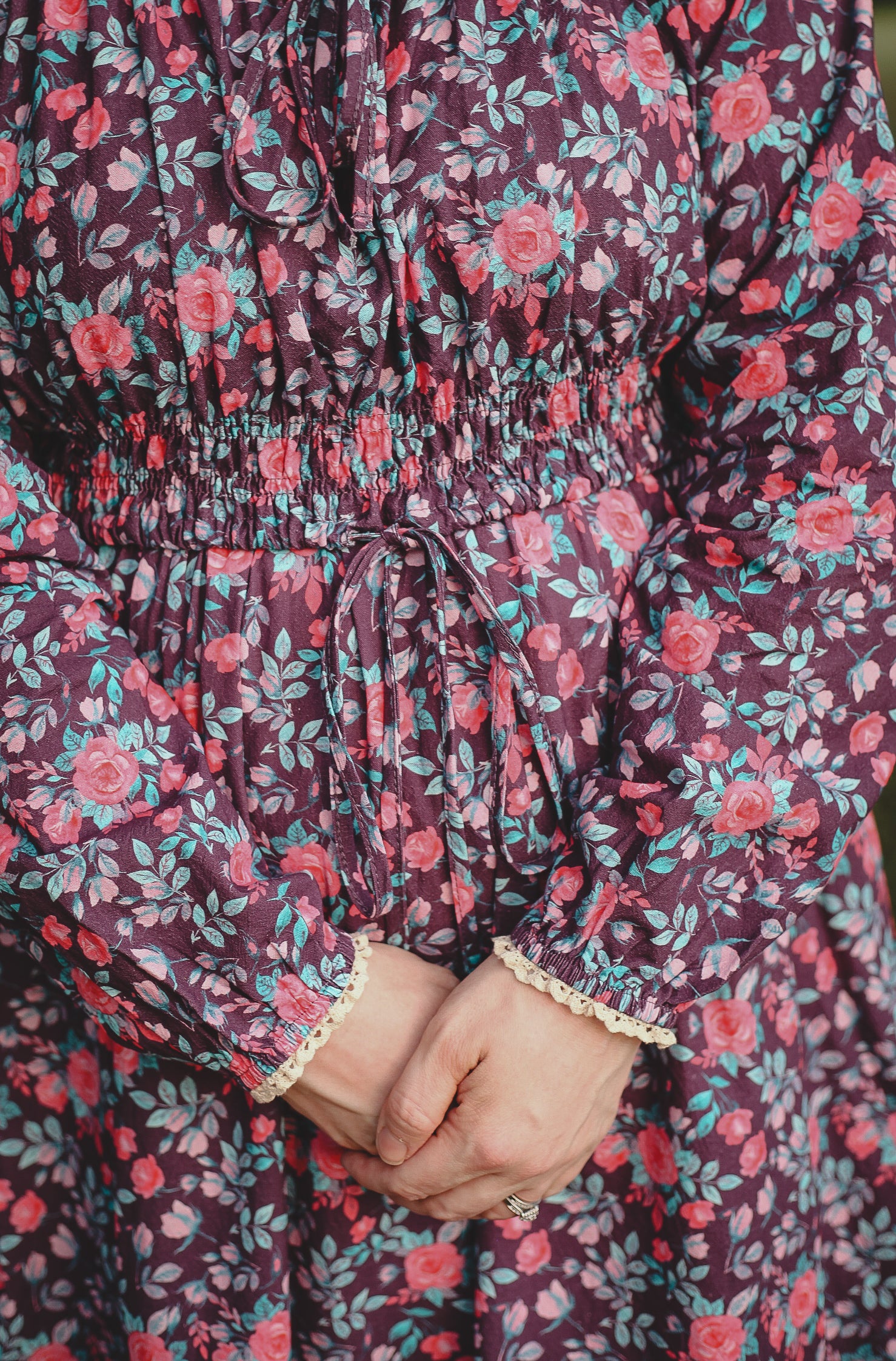 Close-up of modest nursing dress fabric and hands