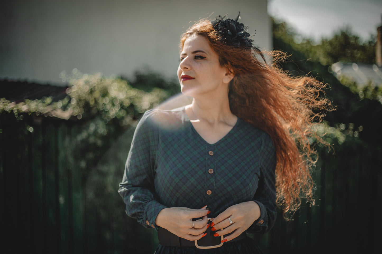 Woman in modest nursing dress red hair outdoors