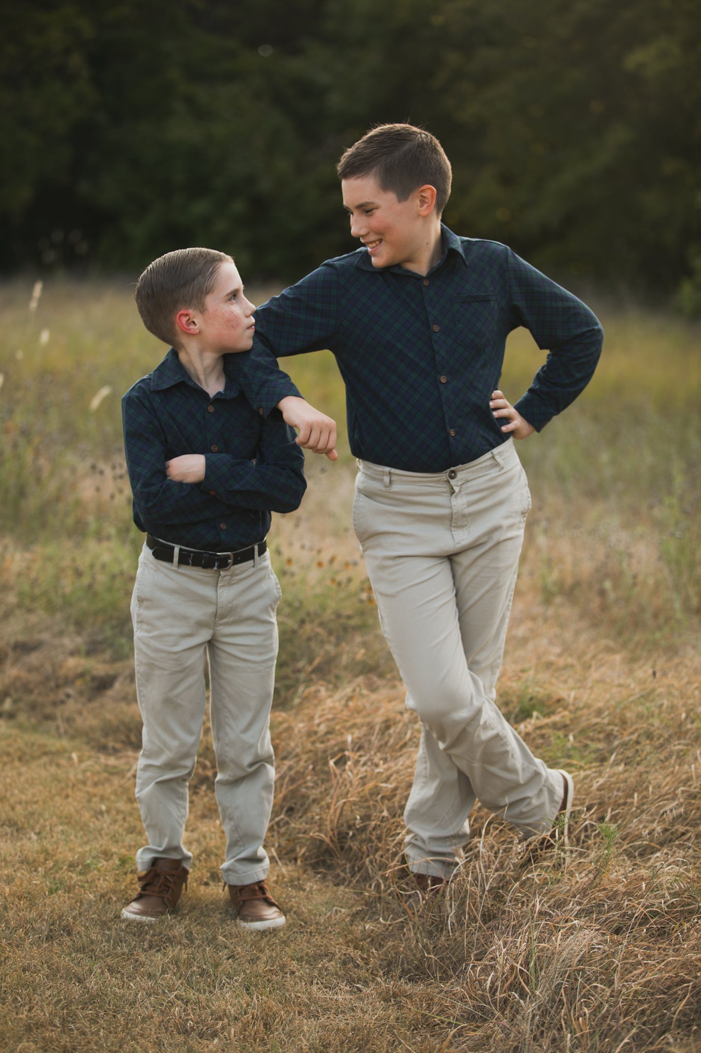 Two boys in matching plaid shirts