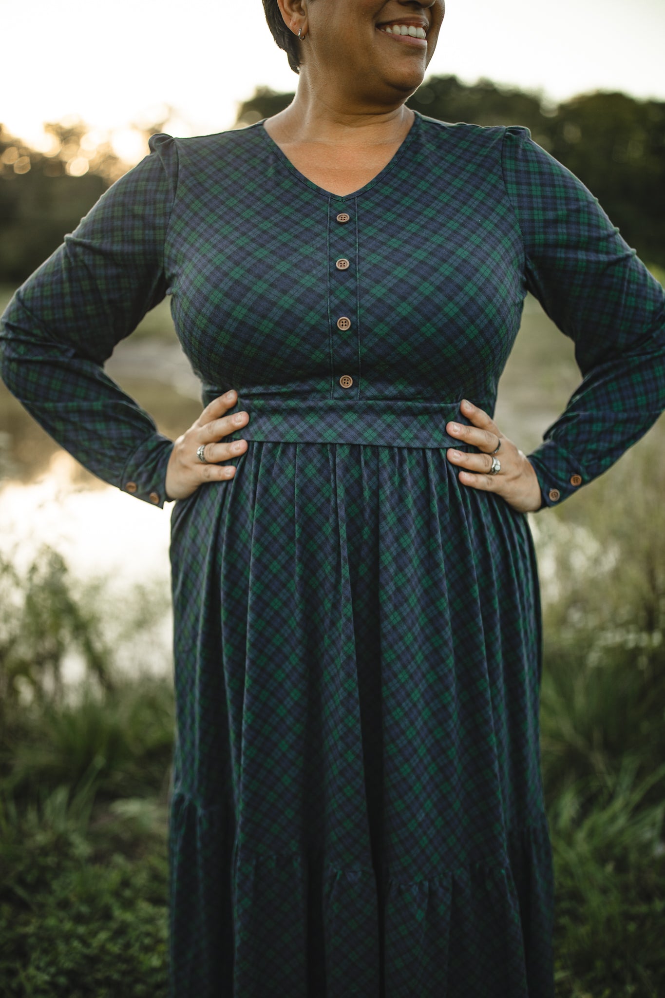 Woman in modest nursing green plaid dress outdoors