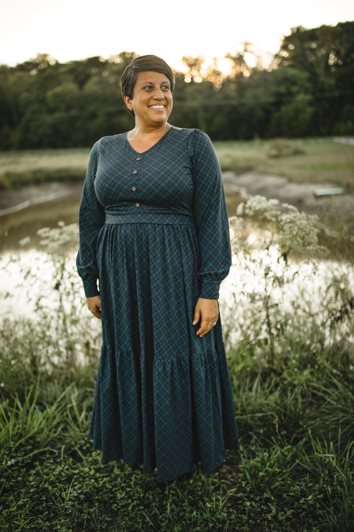 Woman in modest nursing teal dress outdoors