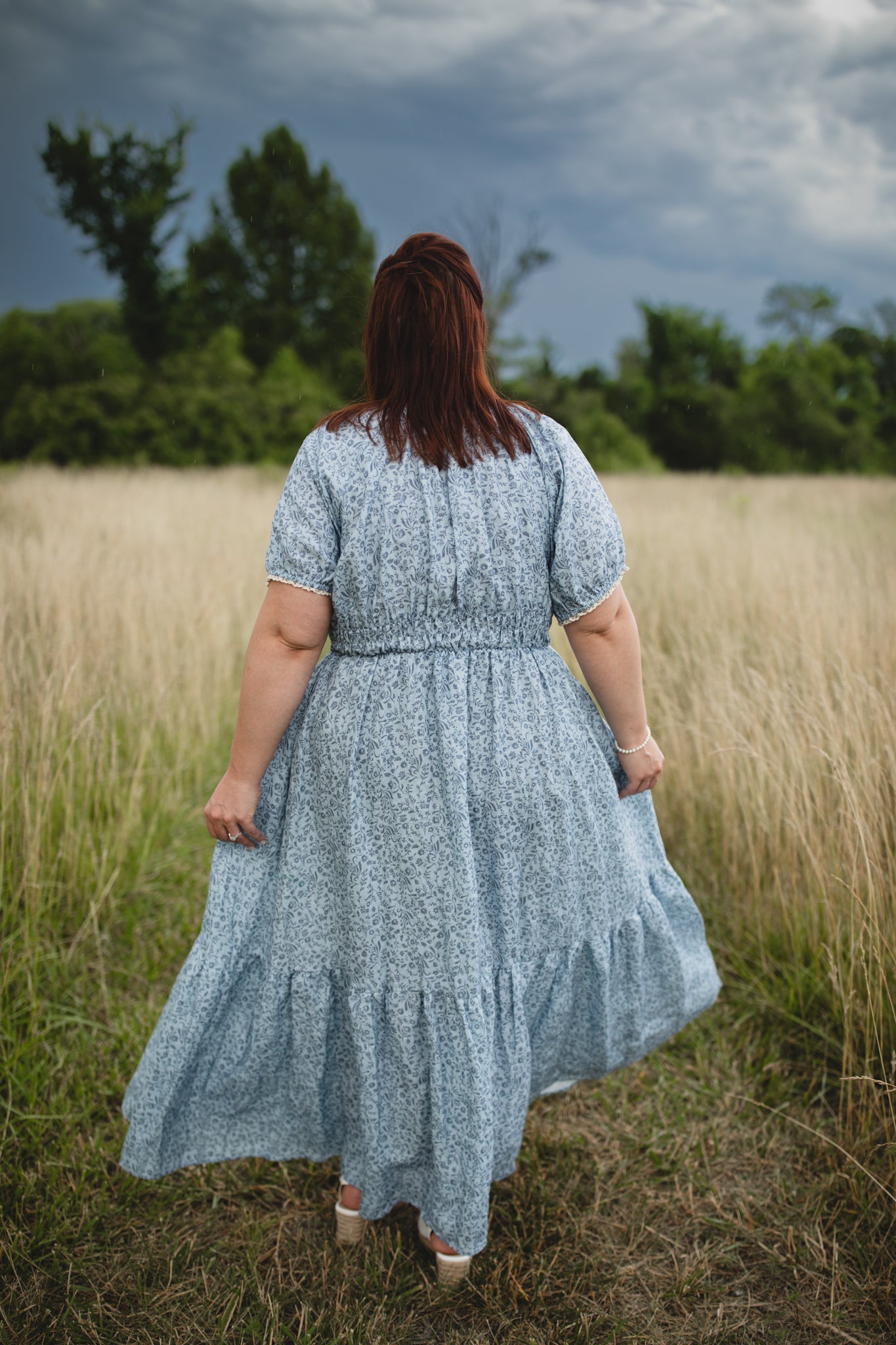 woman in a modest blue nursing dress