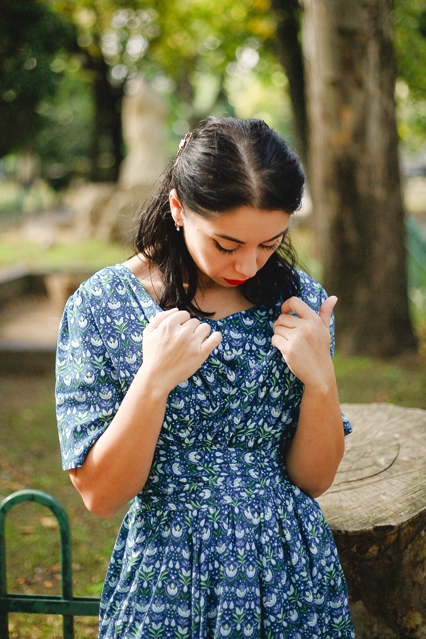 Woman in modest nursing dress in park