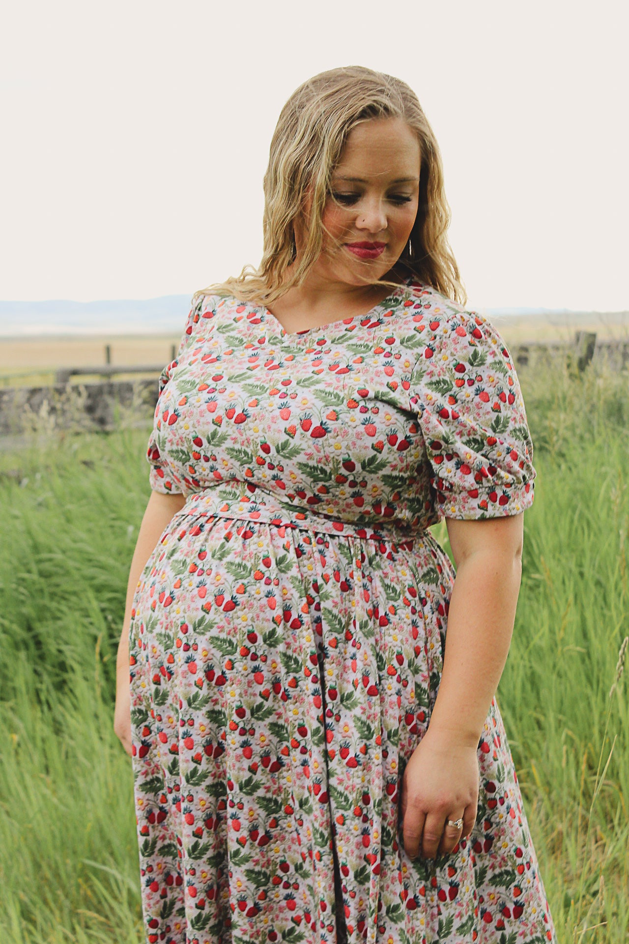 Woman in a floral modest nursing dress.