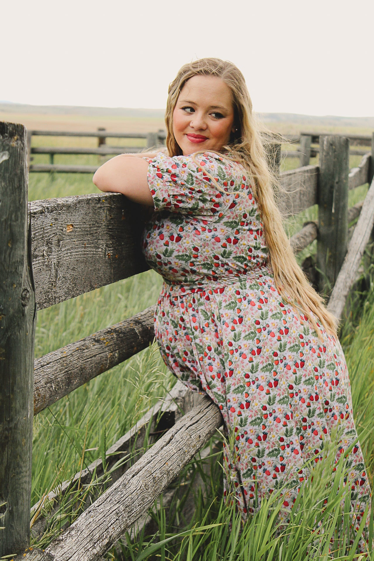 Woman in a floral modest nursing dress.