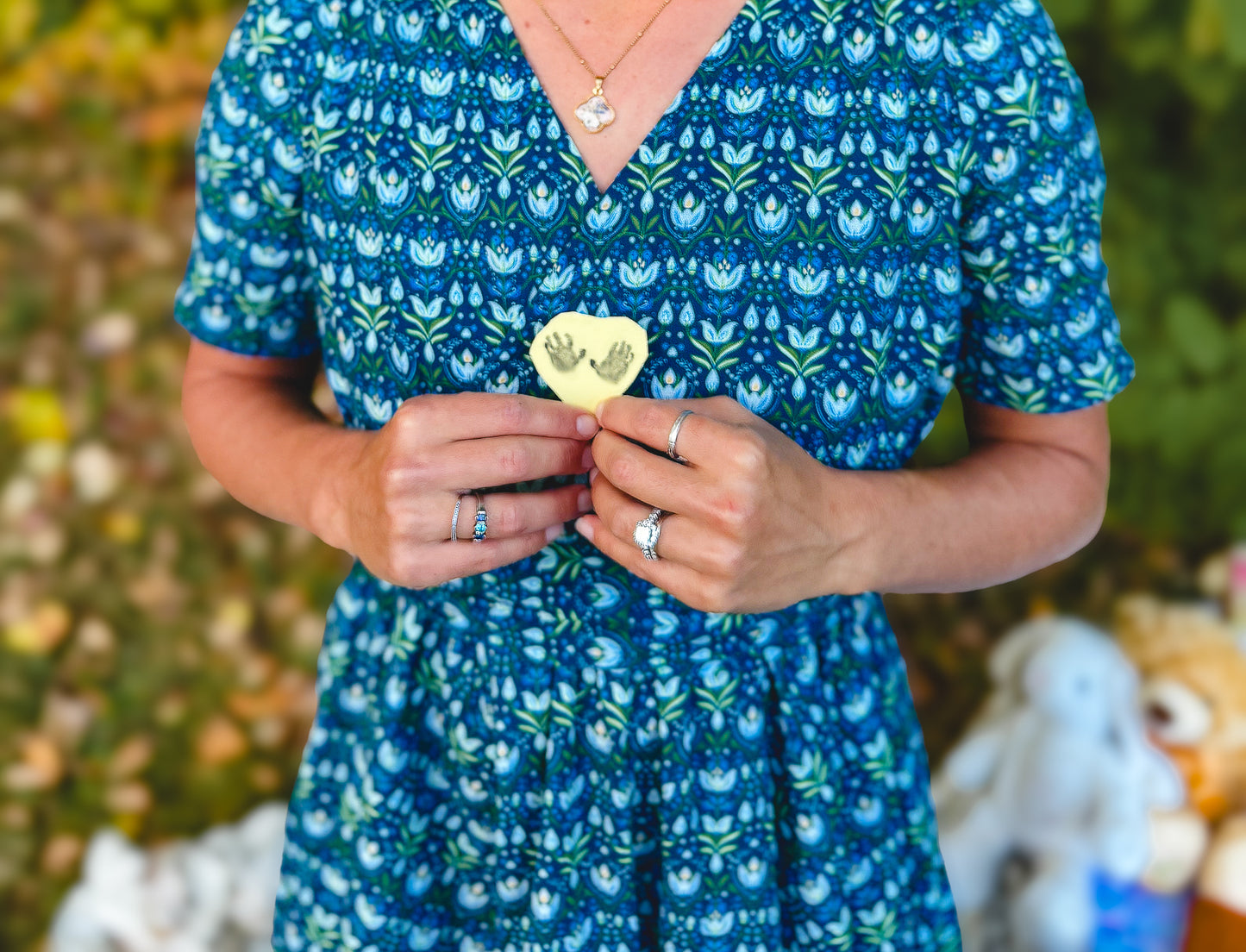 Woman in modest nursing dress holding object