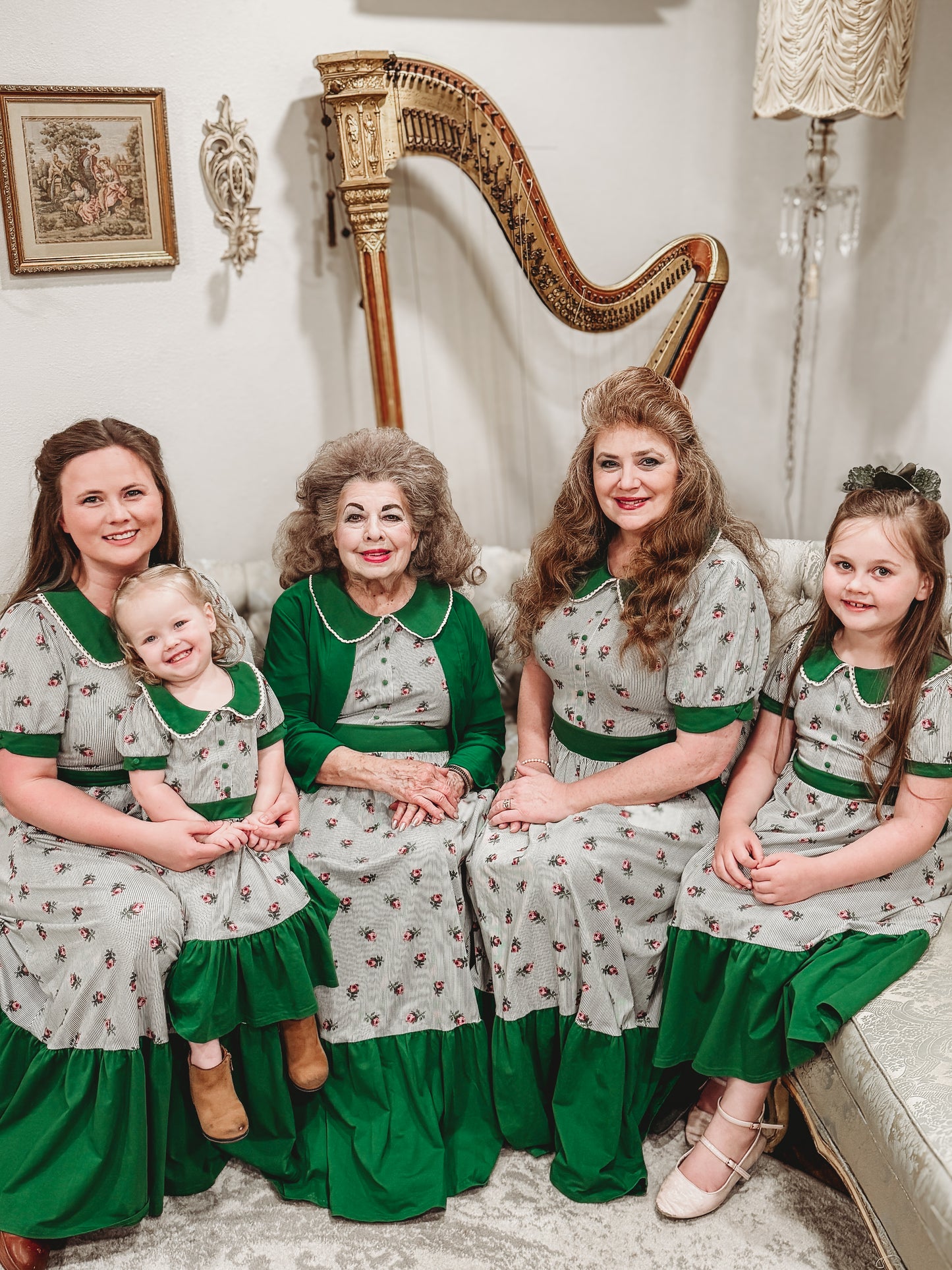 women and young girls wearing green and white striped modest dresses