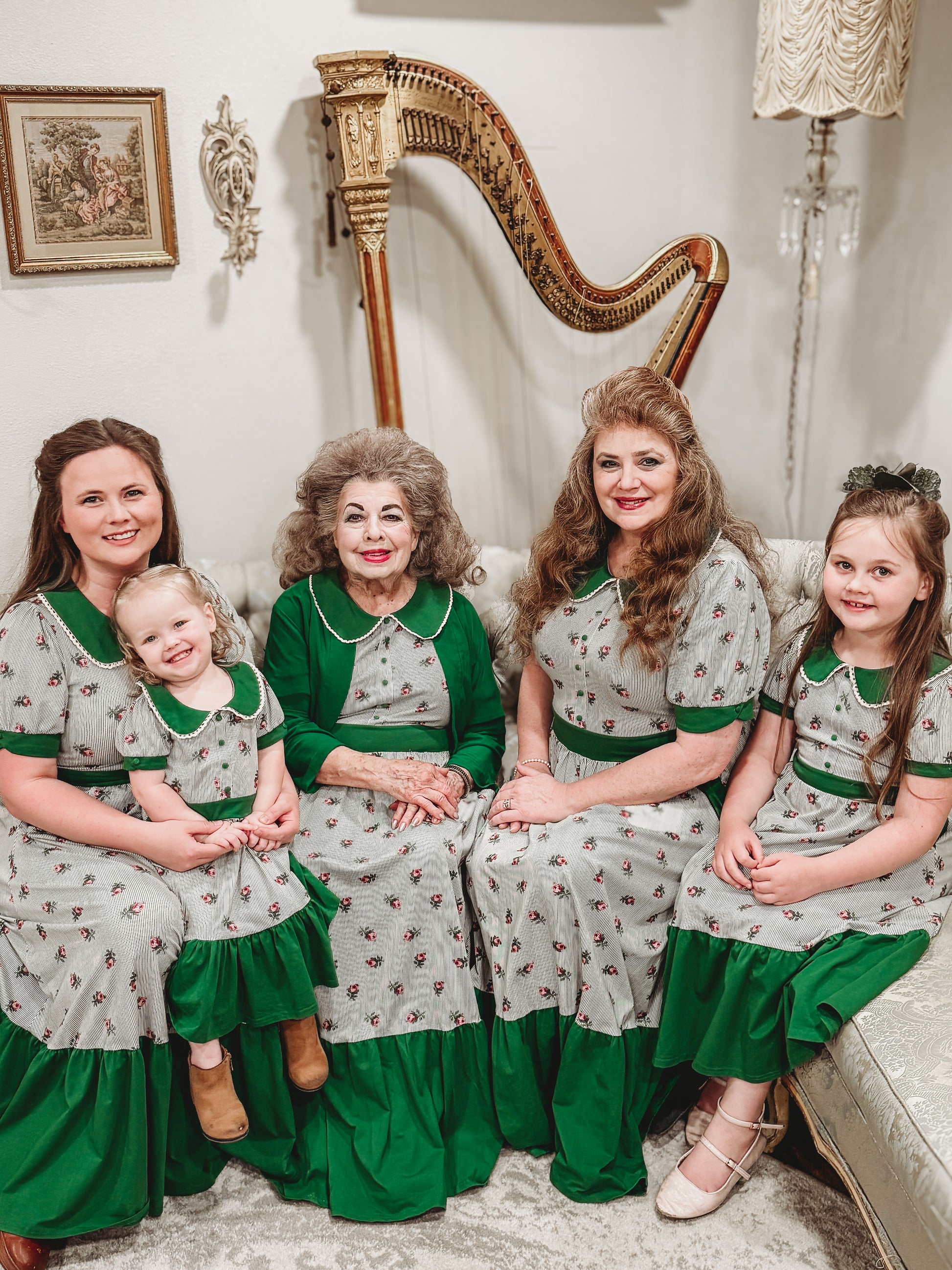 women and young girls wearing green and white striped modest dresses
