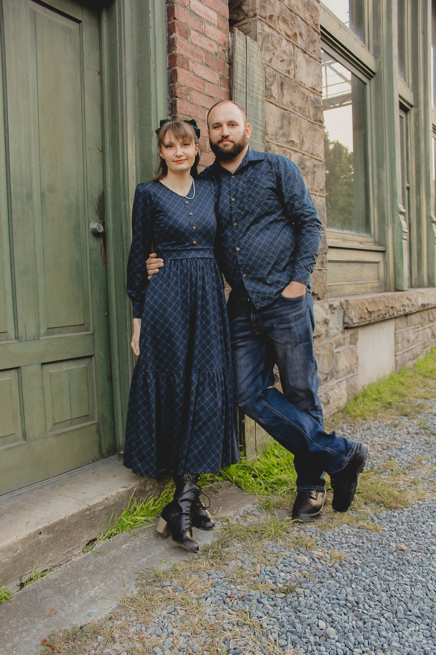 Woman in modest nursing blue dress outdoors with her husband
