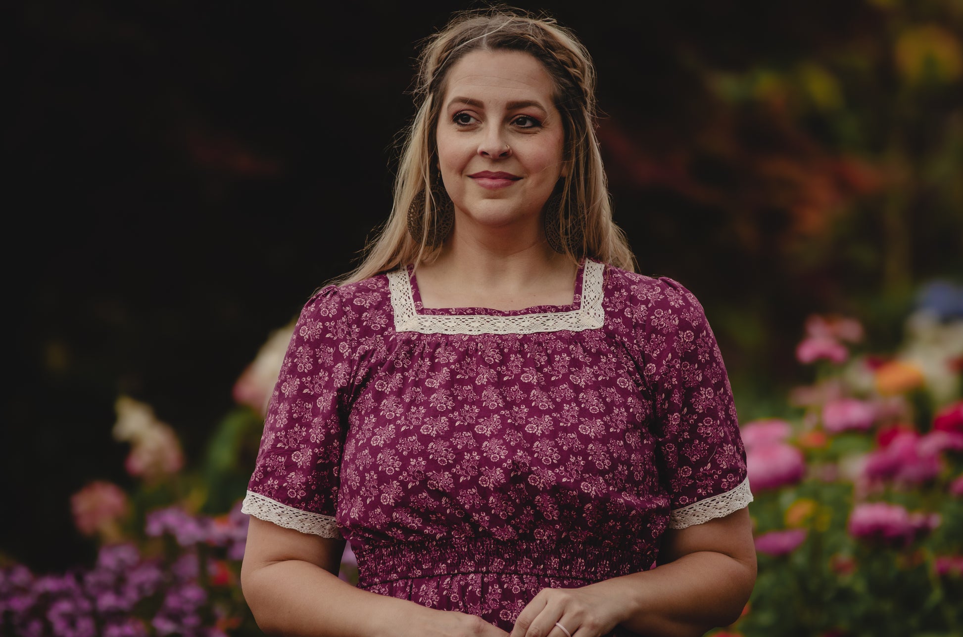 Woman in modest purple floral nursing dress outdoors
