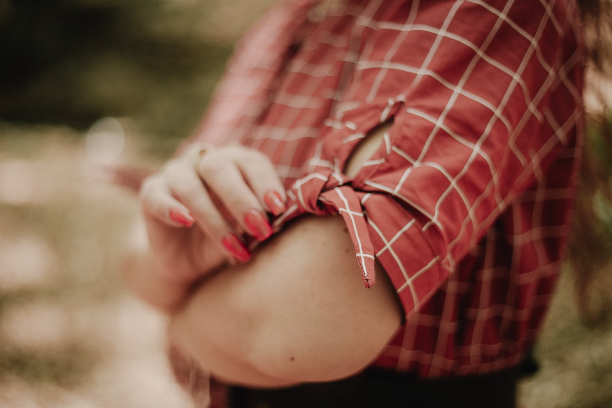 Woman in modest nursing red plaid shirt detail