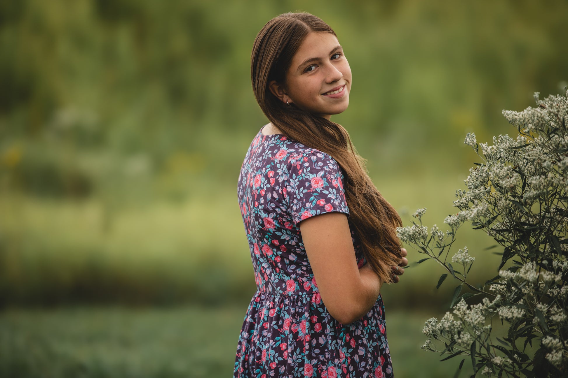 Woman in modest nursing floral dress outdoors